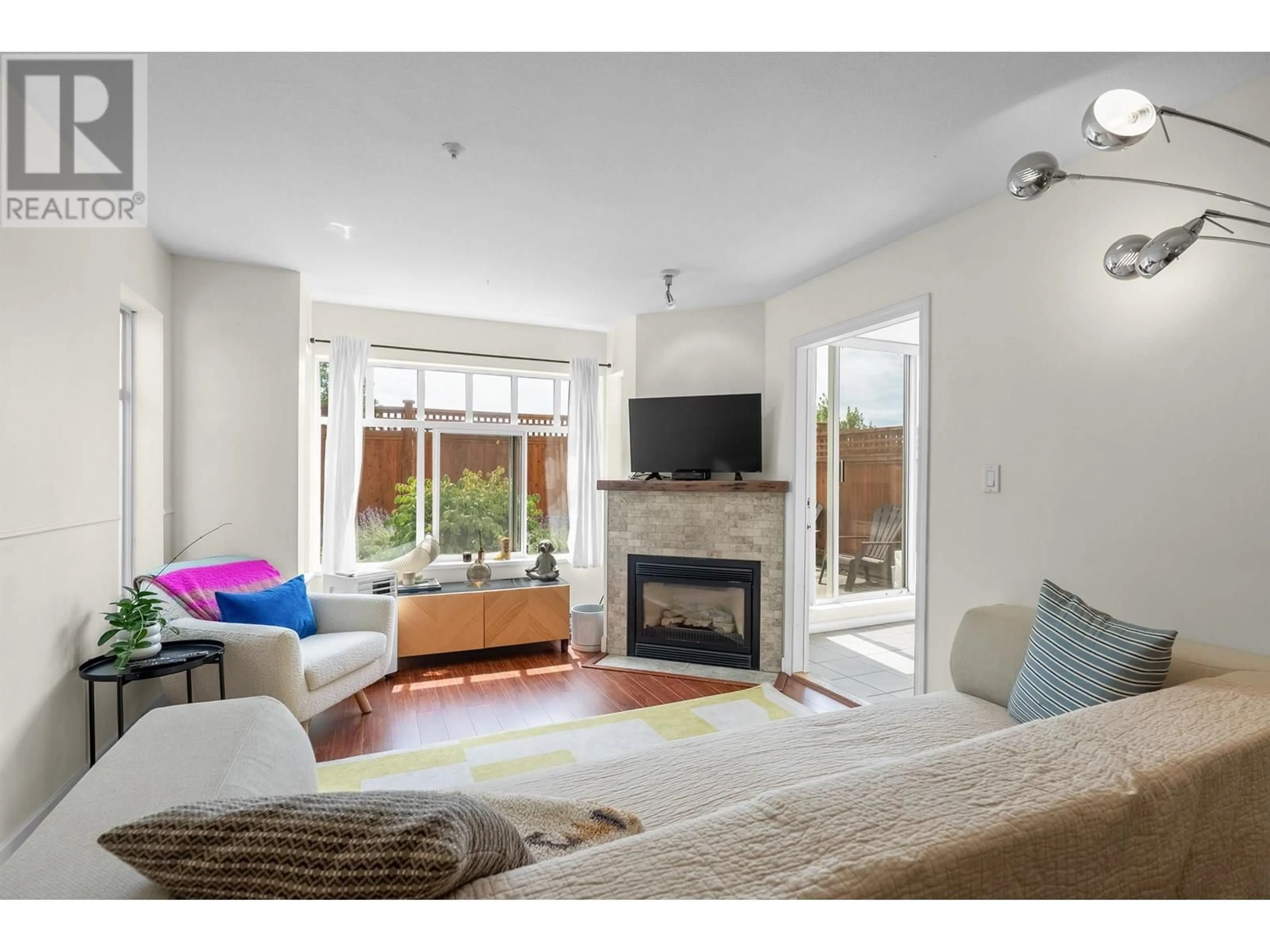 Living room with furniture, wood/laminate floor for 115 - 630 ROCHE POINT DRIVE, North Vancouver British Columbia V7H3A1