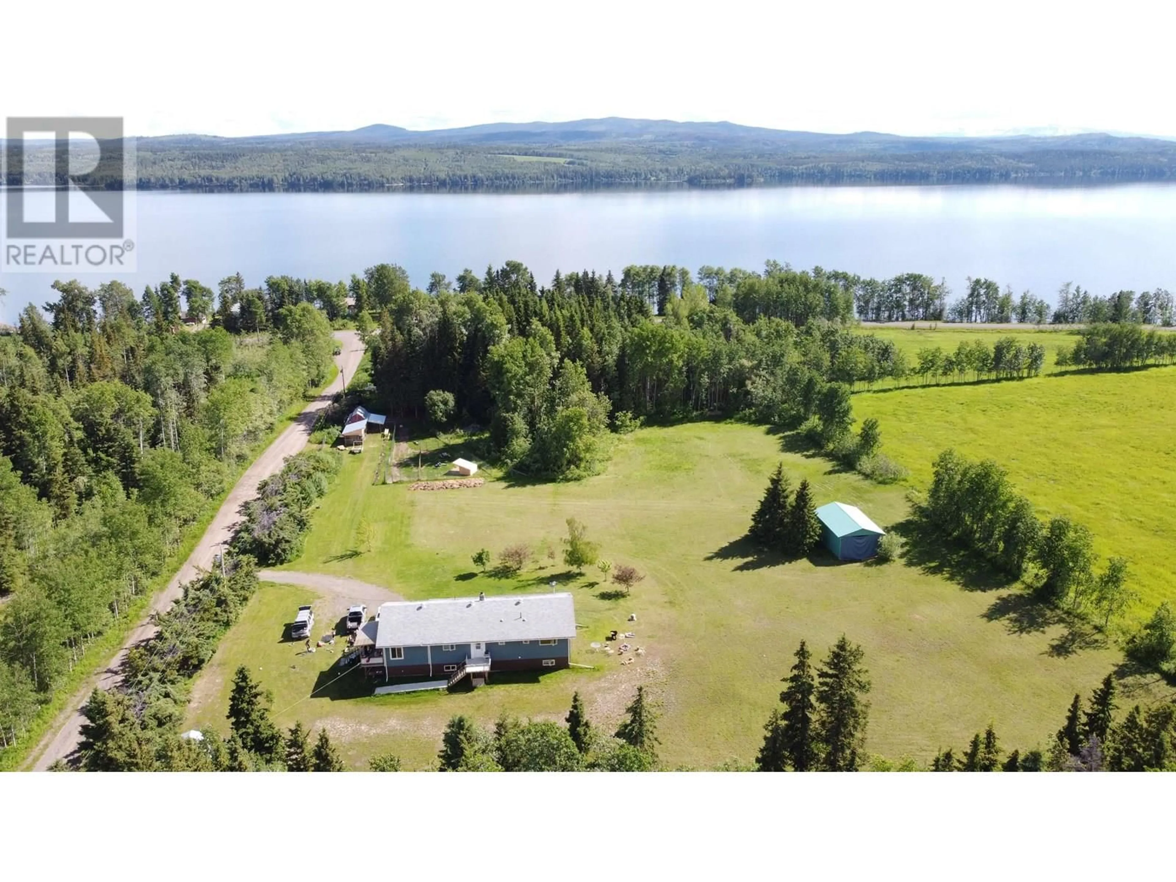 A pic from outside/outdoor area/front of a property/back of a property/a pic from drone, water/lake/river/ocean view for 21367 SHORT ROAD, Burns Lake British Columbia V0J1E2