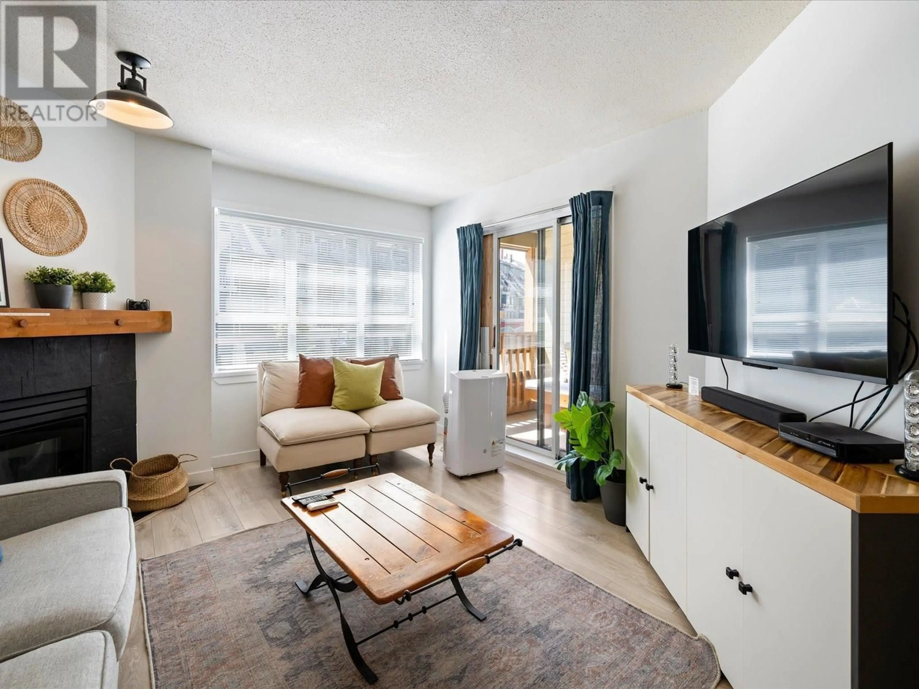 Living room with furniture, wood/laminate floor for 253 - 4340 LORIMER ROAD, Whistler British Columbia V8E1A5