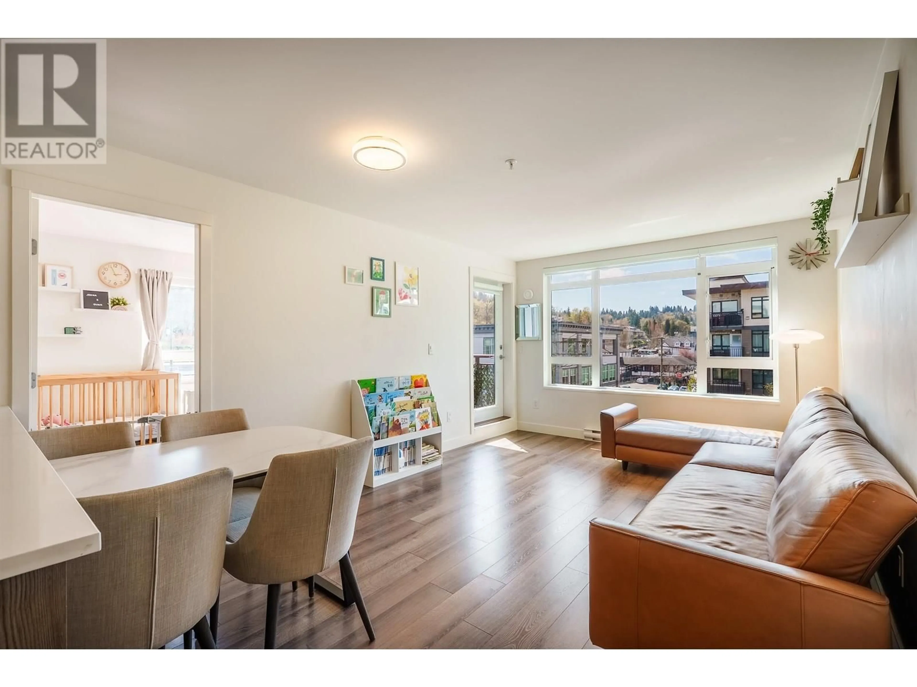 Living room with furniture, wood/laminate floor for 418 - 2525 CLARKE STREET, Port Moody British Columbia V3H0J3
