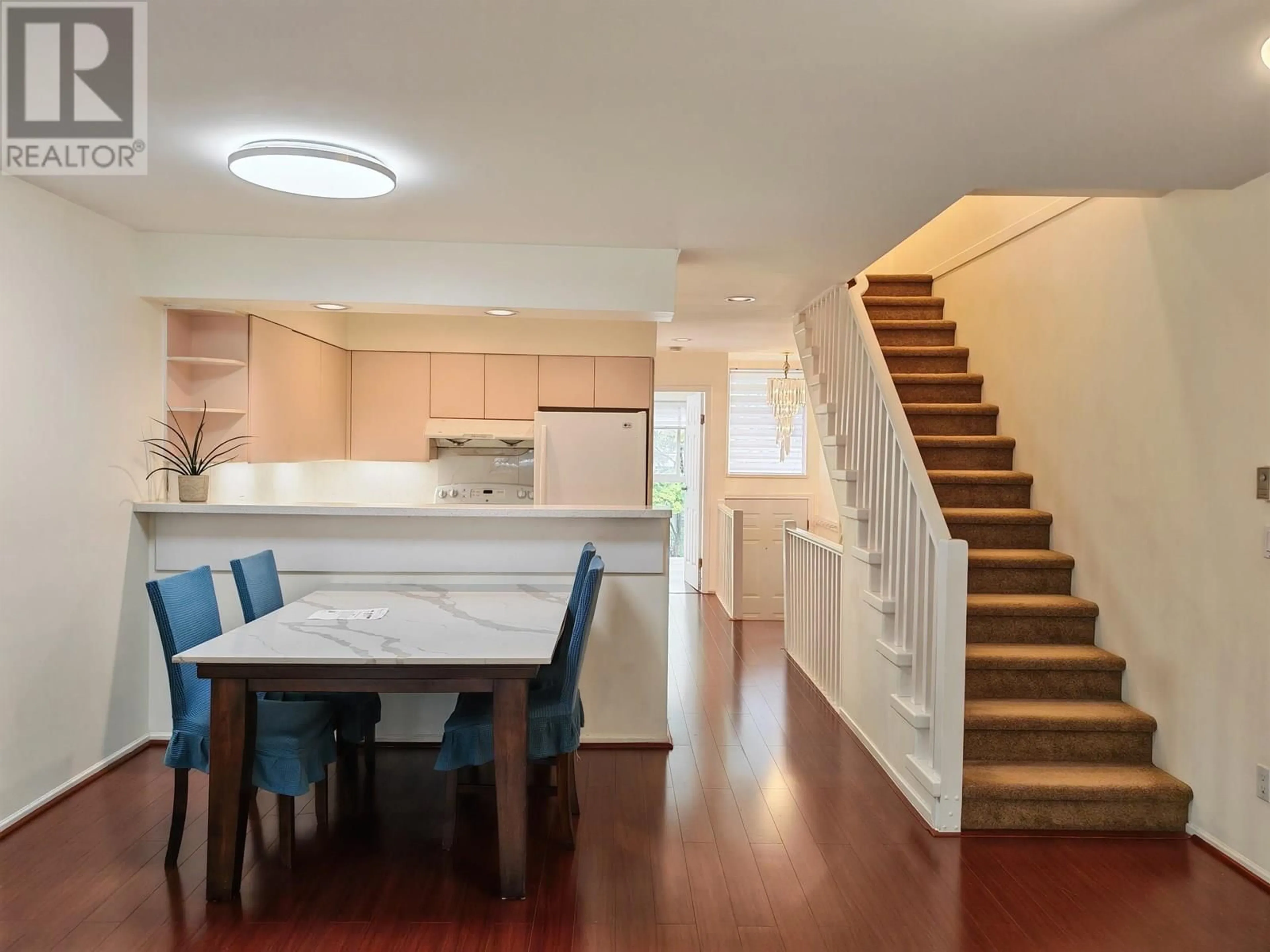 Open concept kitchen, wood/laminate floor for 3350 COBBLESTONE AVENUE, Vancouver British Columbia V5S4S4