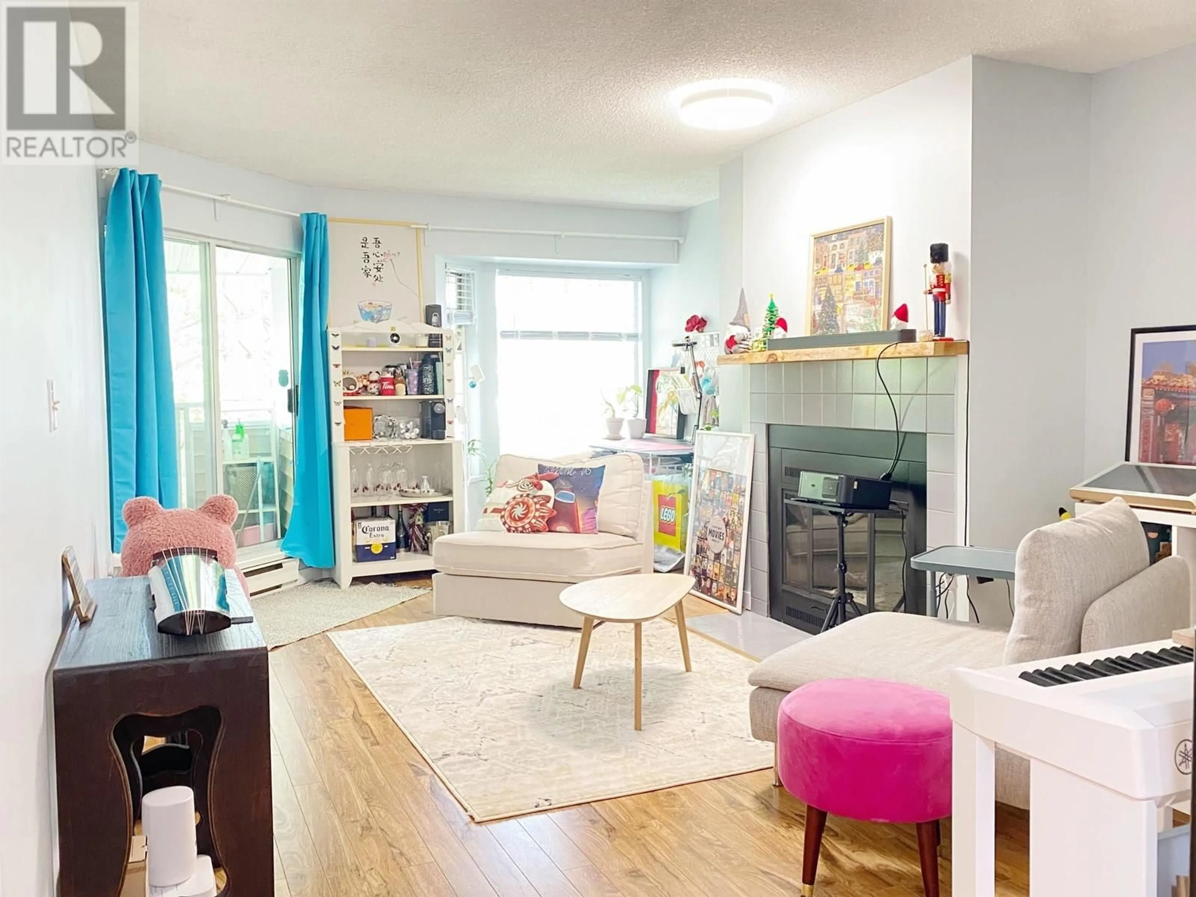 Living room with furniture, wood/laminate floor for 220 - 7571 MOFFATT ROAD, Richmond British Columbia V6Y3N1