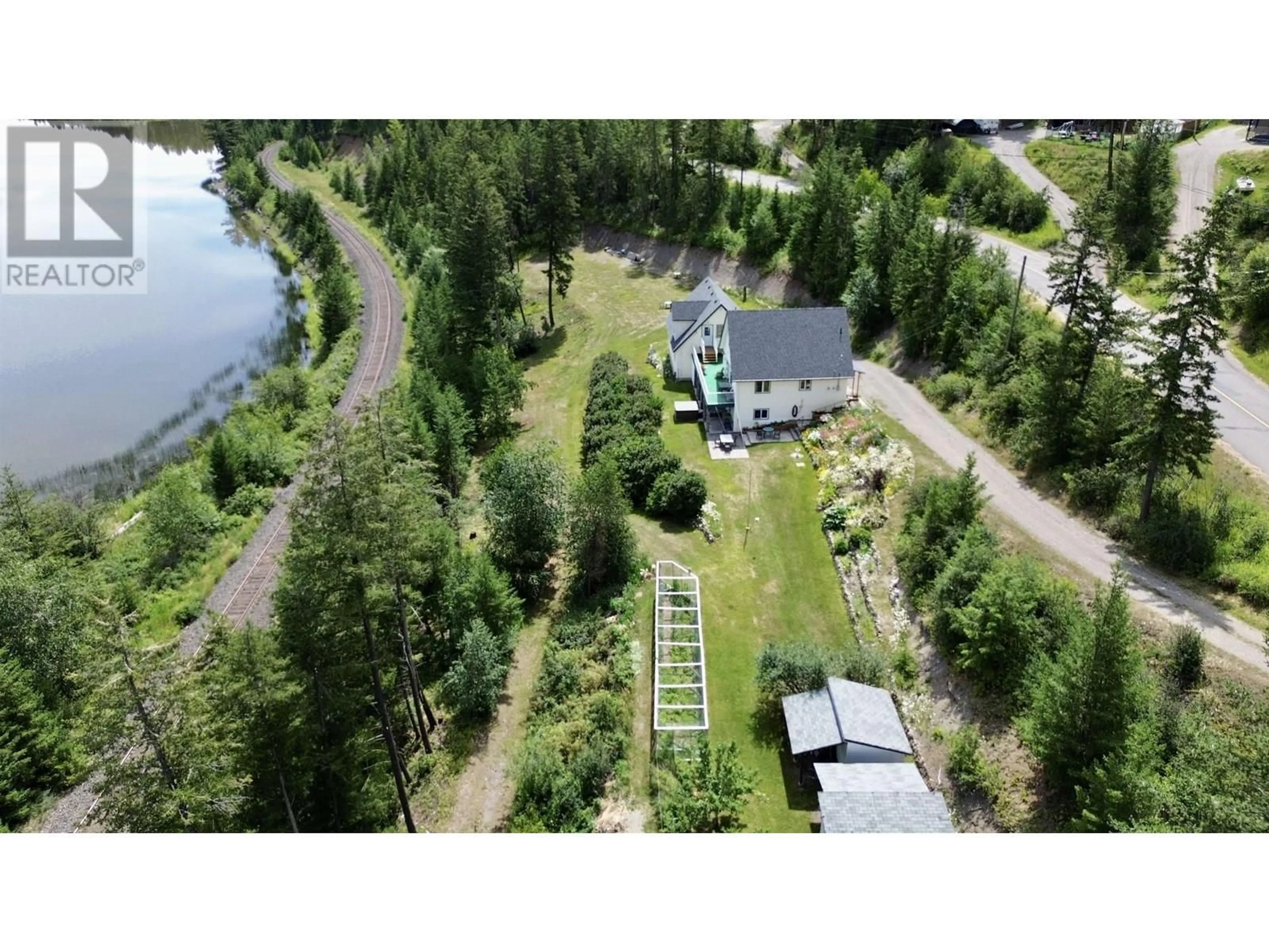 A pic from outside/outdoor area/front of a property/back of a property/a pic from drone, water/lake/river/ocean view for 1946 SOUTH LAKESIDE DRIVE, Williams Lake British Columbia V2G5G1