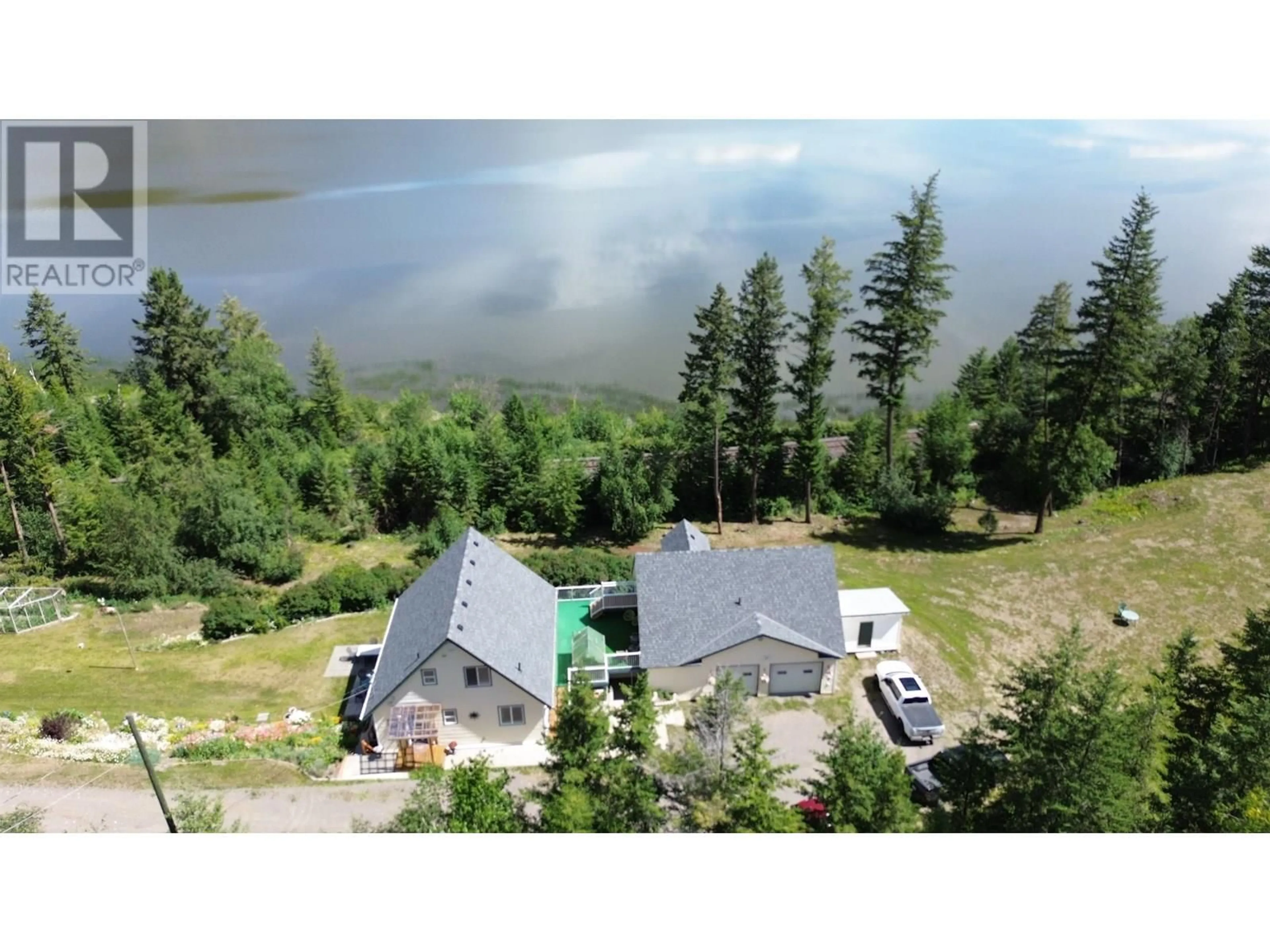 A pic from outside/outdoor area/front of a property/back of a property/a pic from drone, mountain view for 1946 SOUTH LAKESIDE DRIVE, Williams Lake British Columbia V2G5G1
