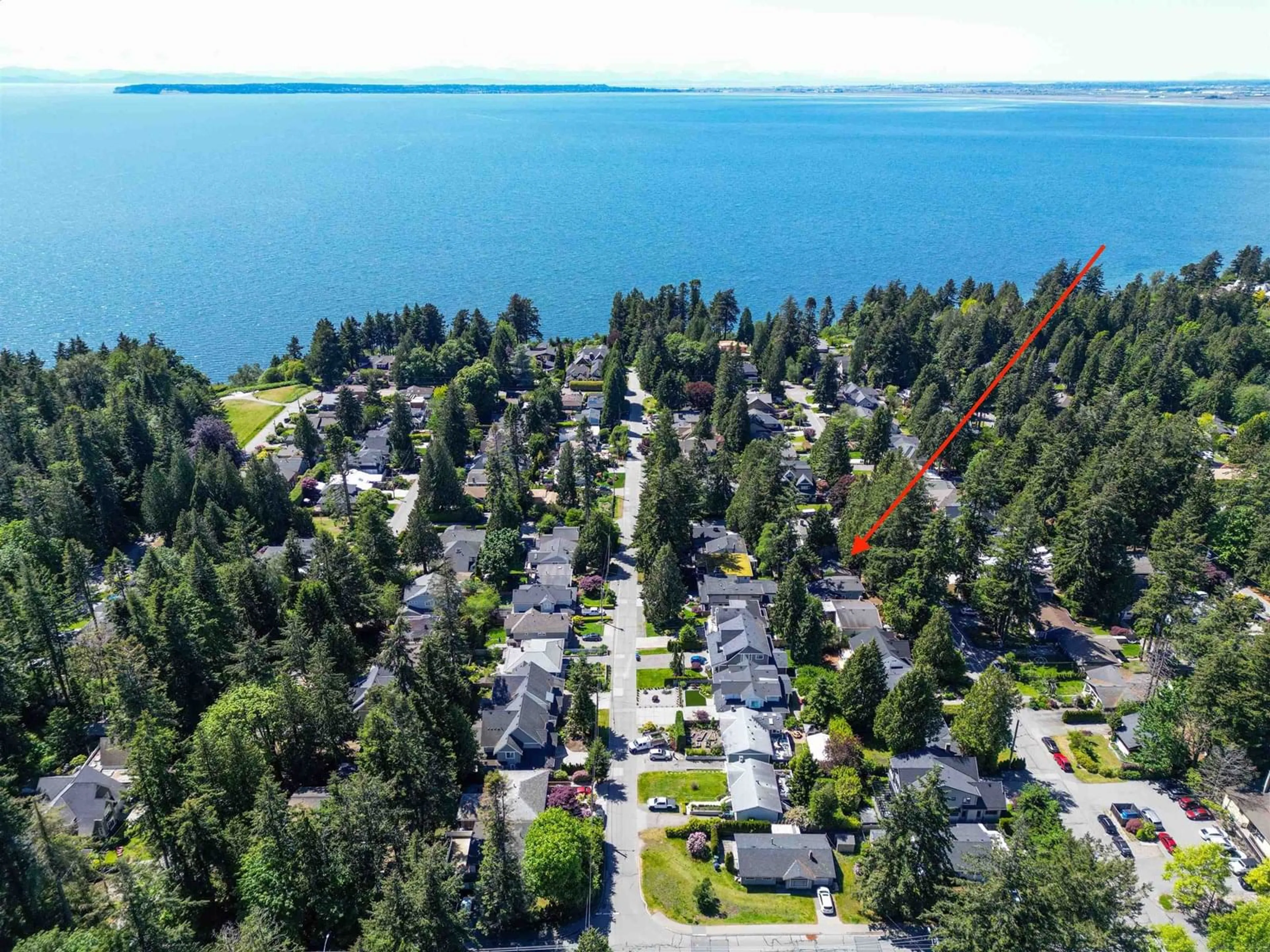 A pic from outside/outdoor area/front of a property/back of a property/a pic from drone, water/lake/river/ocean view for 12730 15A, Surrey British Columbia V4A1M1