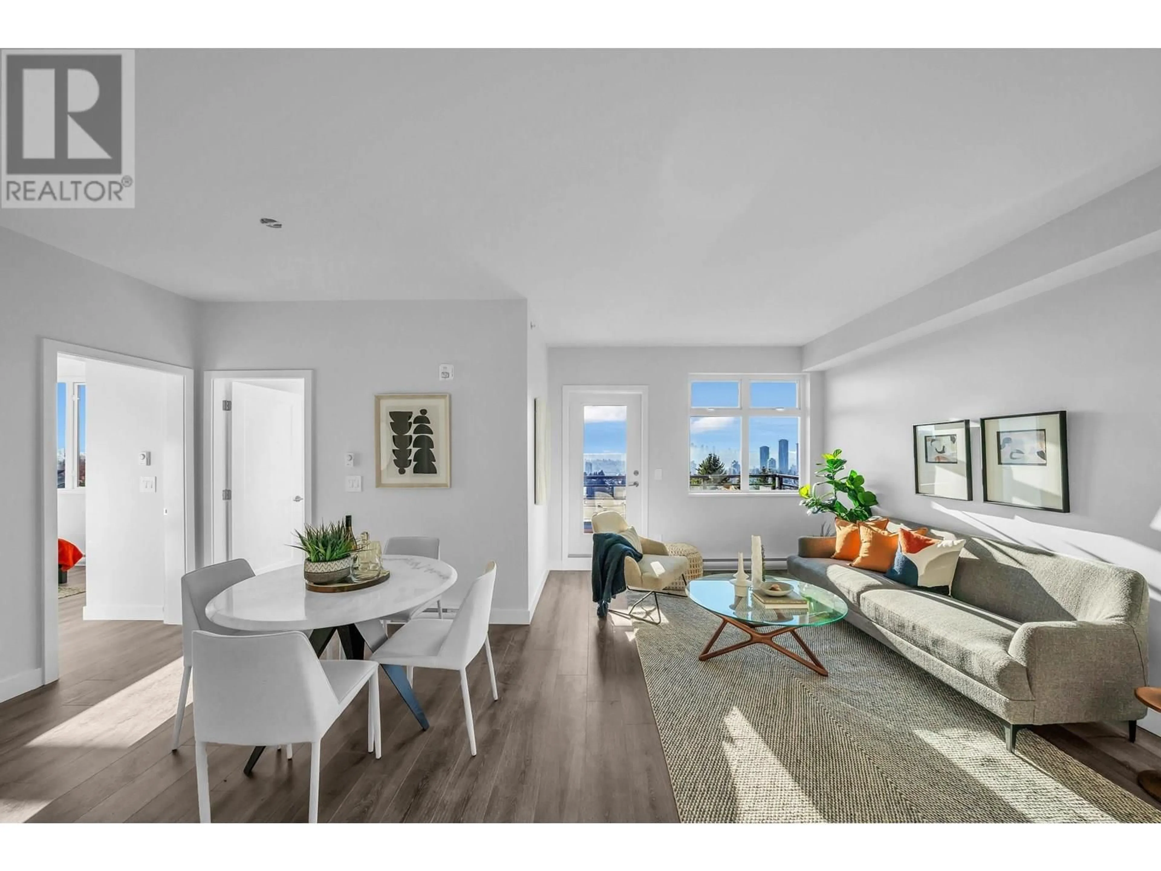 Living room with furniture, wood/laminate floor for 404 - 5535 HASTINGS STREET, Burnaby British Columbia V5B1R2