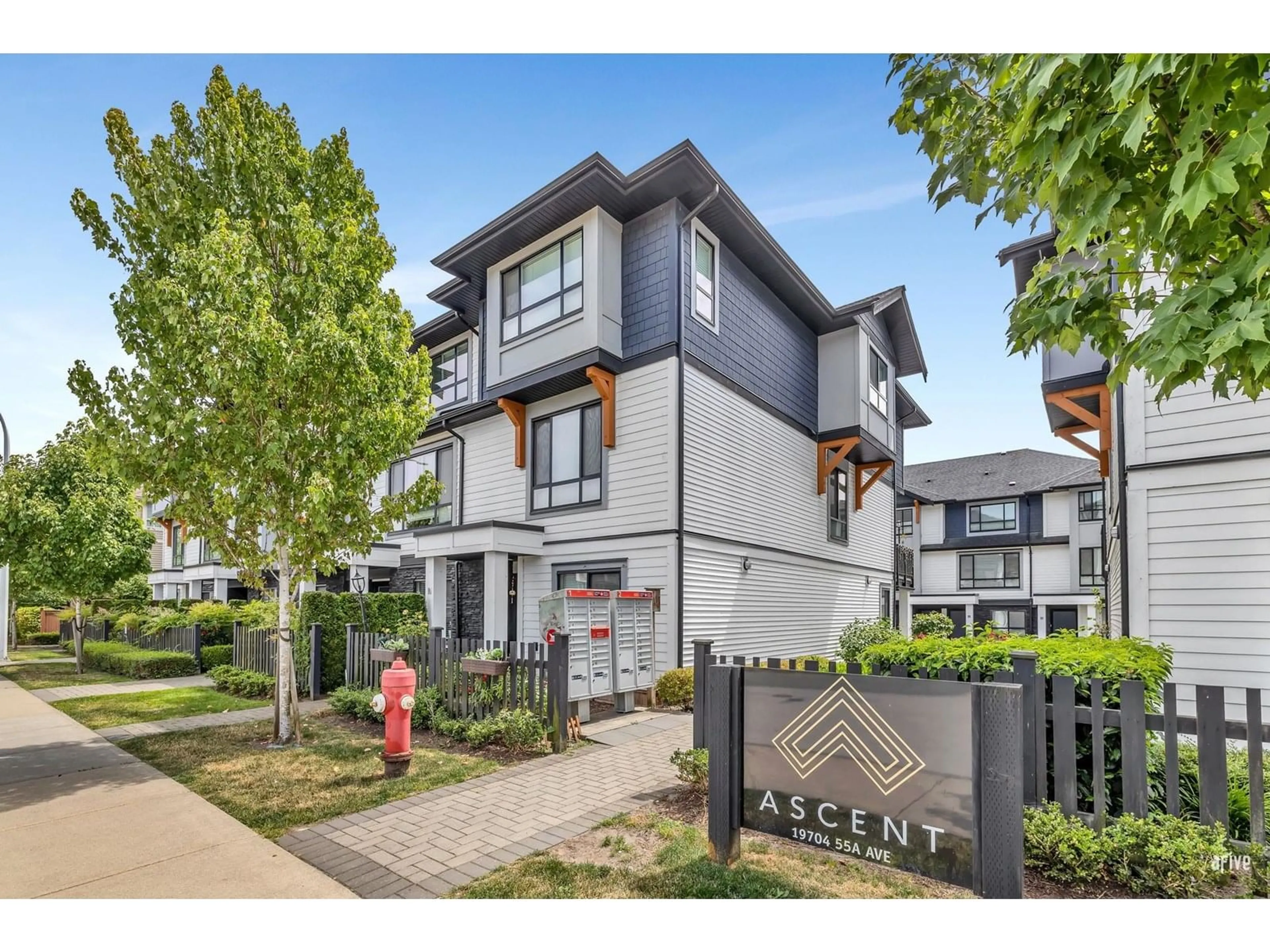 A pic from outside/outdoor area/front of a property/back of a property/a pic from drone, street for 9 - 19704 55A, Langley British Columbia V3A0L2