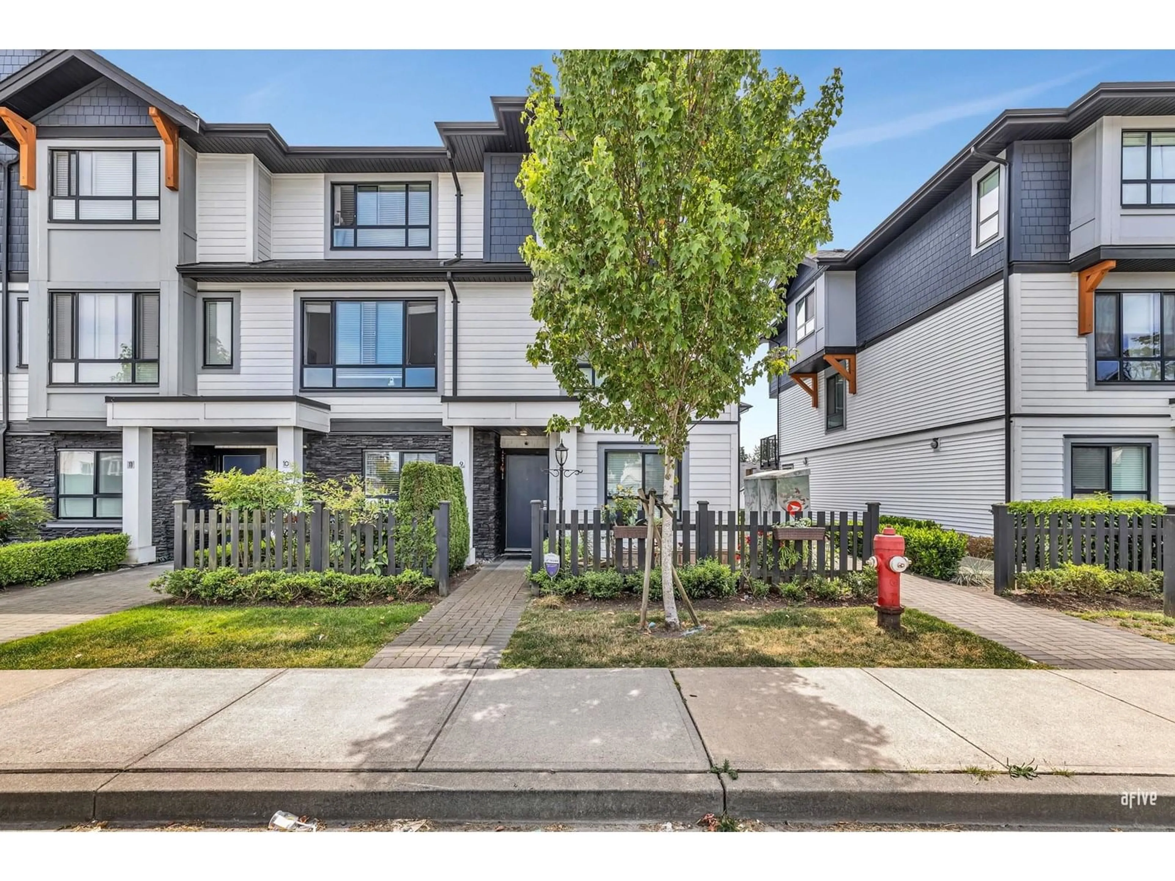 A pic from outside/outdoor area/front of a property/back of a property/a pic from drone, street for 9 - 19704 55A, Langley British Columbia V3A0L2