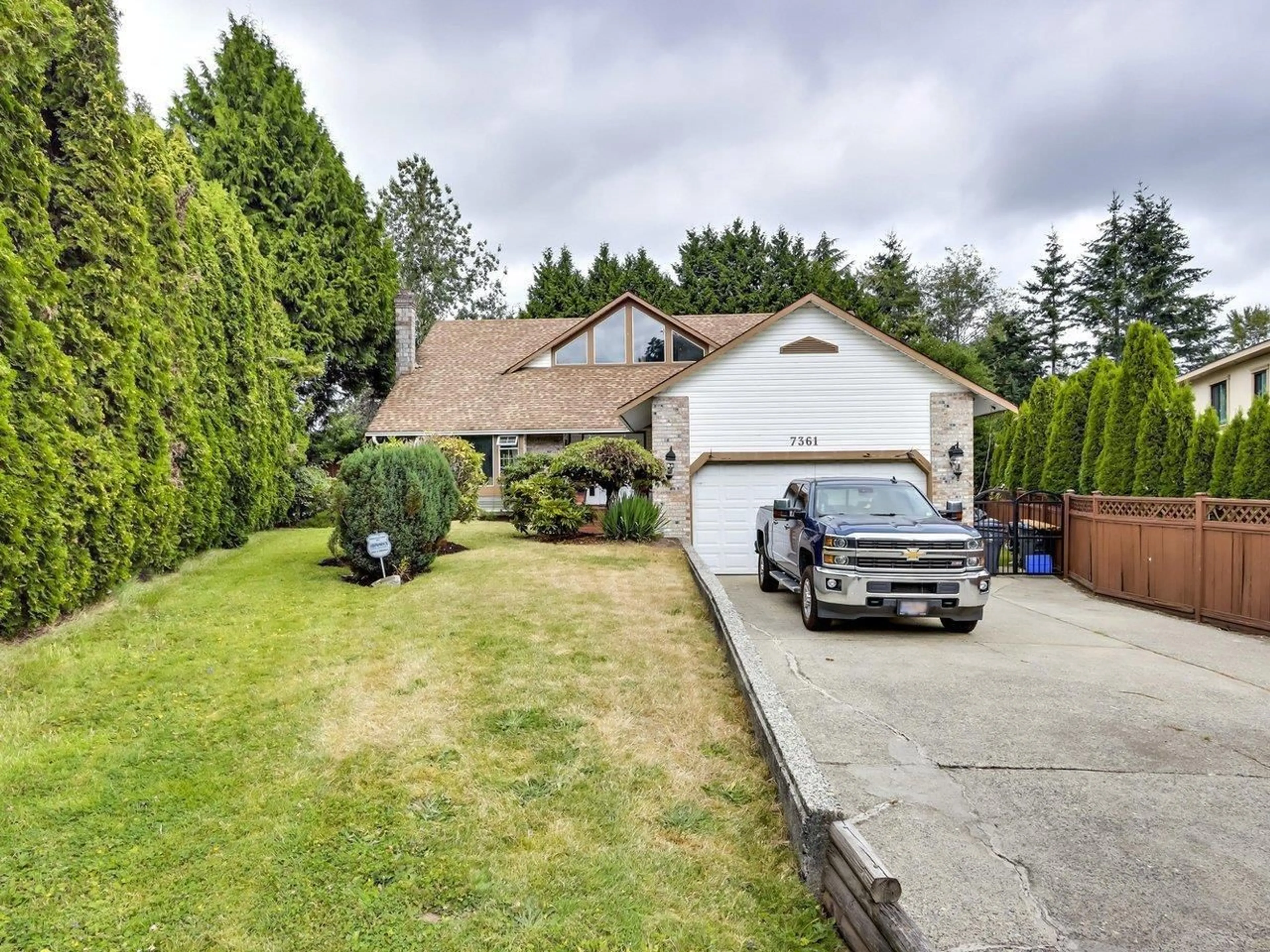 A pic from outside/outdoor area/front of a property/back of a property/a pic from drone, street for 7361 149A, Surrey British Columbia V3S3H4