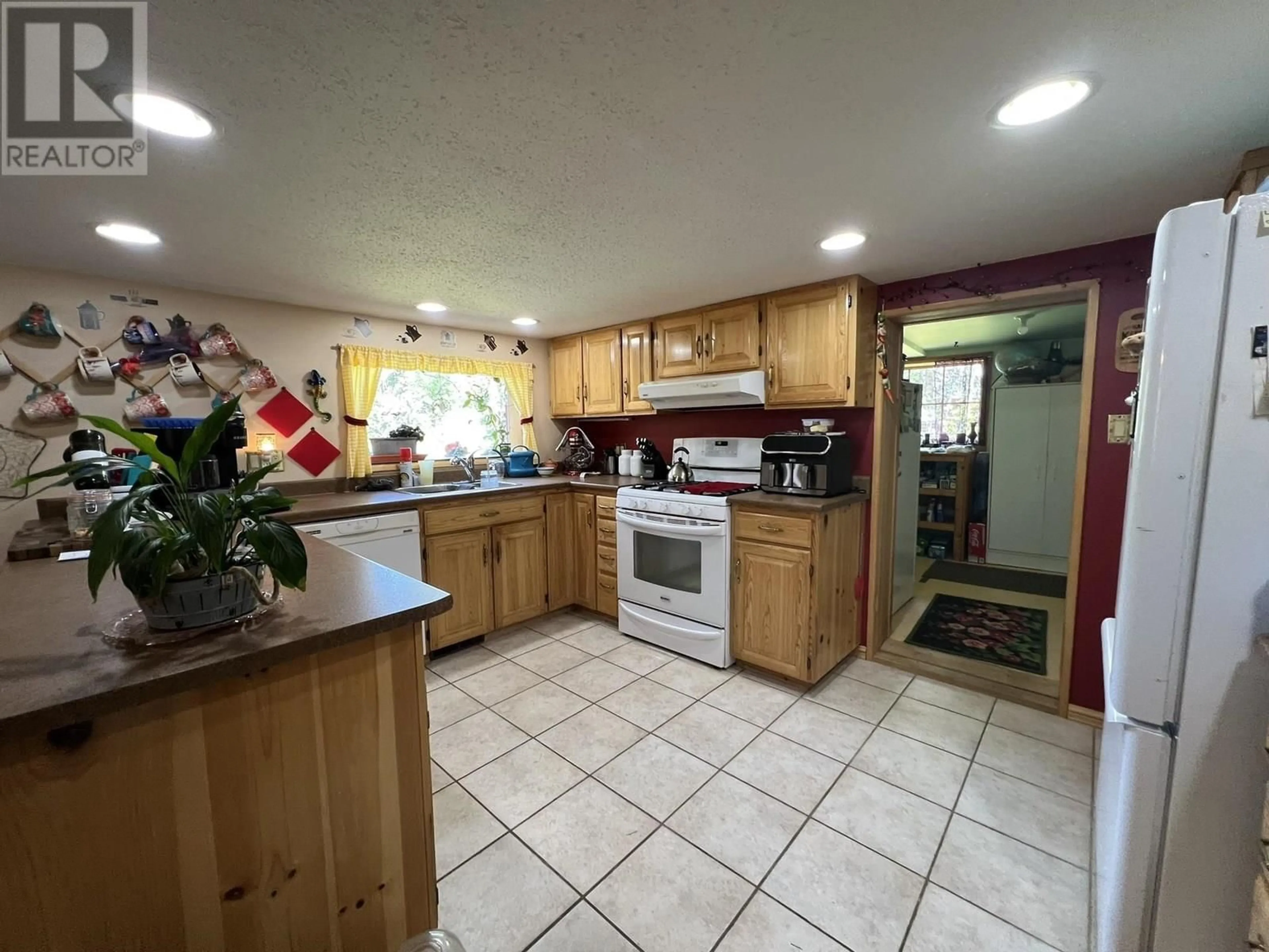 Open concept kitchen, ceramic/tile floor for 6273 MOOSE POINT DRIVE, Lone Butte British Columbia V0K2K1