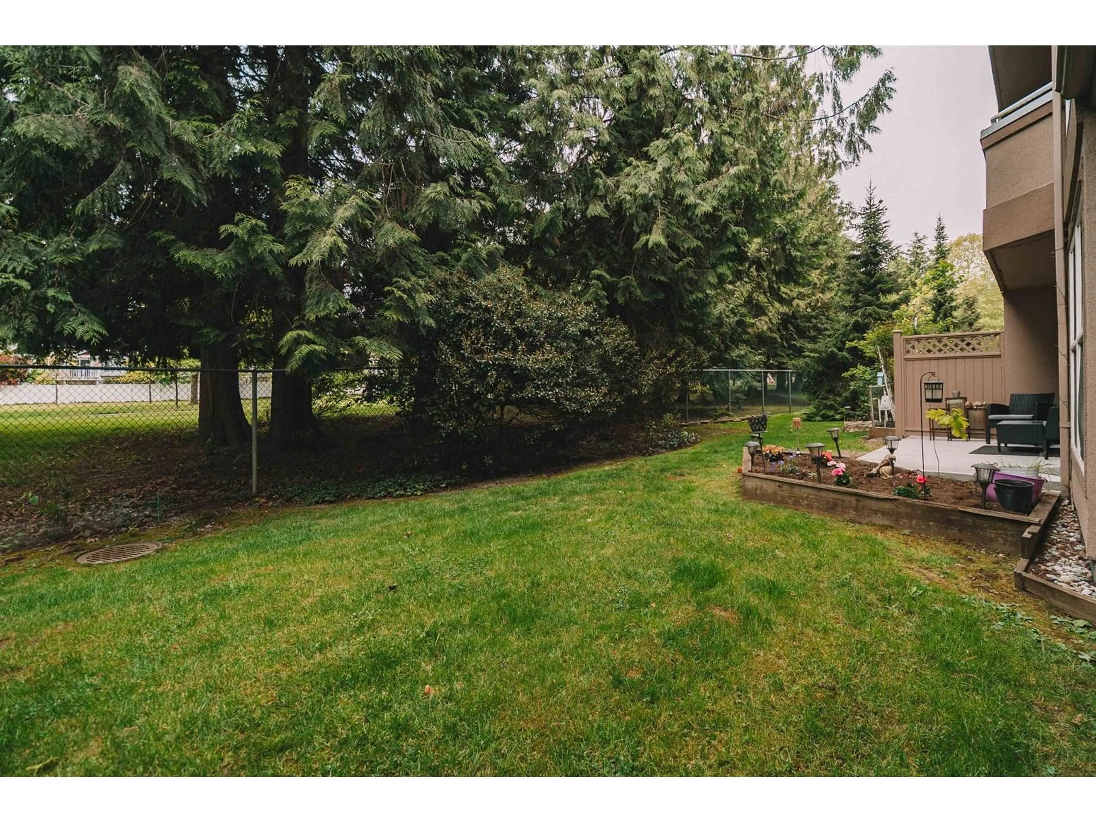 Patio, forest/trees view for 111 - 7435 121A, Surrey British Columbia V3W0W8