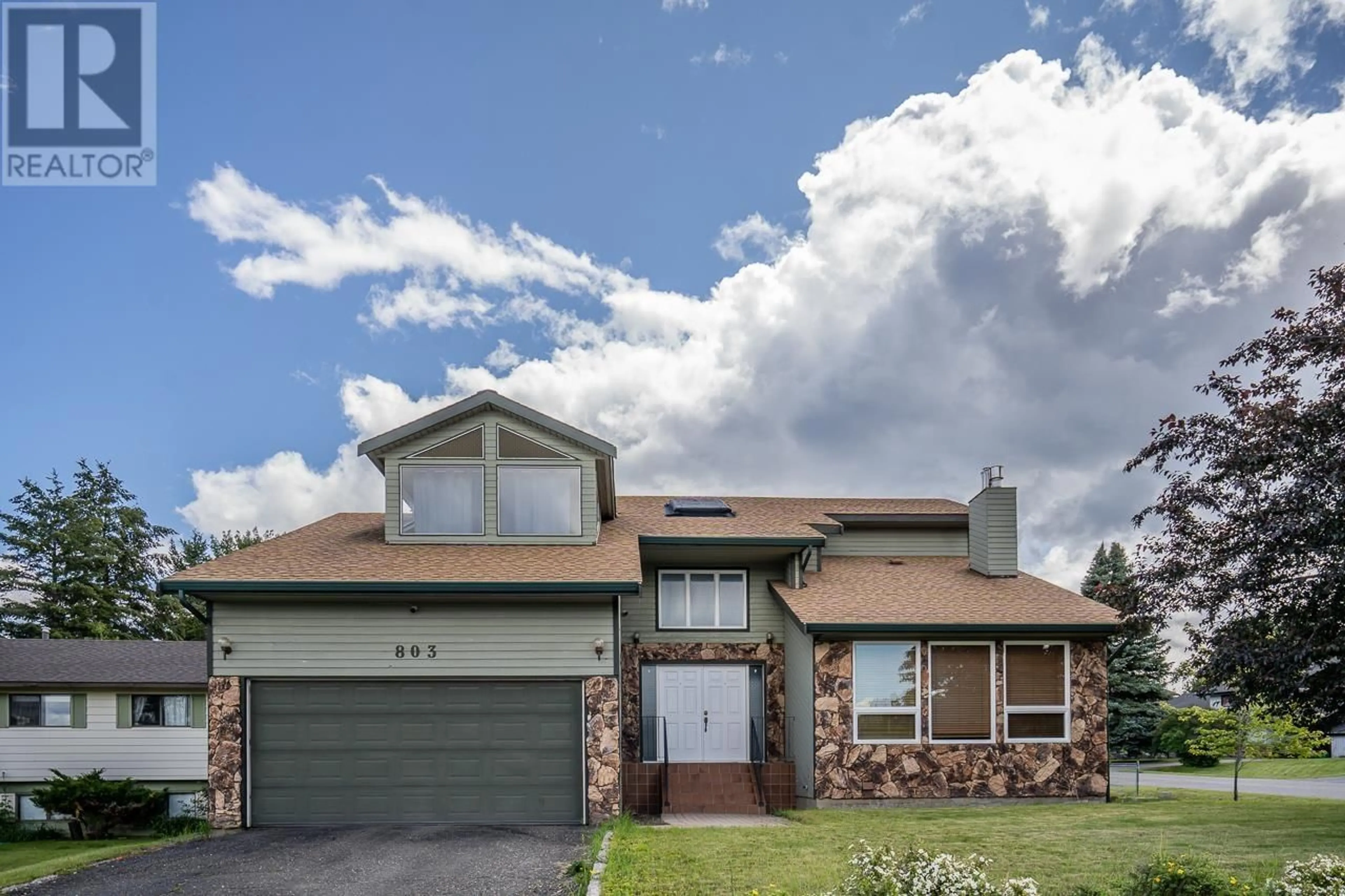 Home with brick exterior material, street for 803 CARIBOO TRAIL, 100 Mile House British Columbia V0K2E0