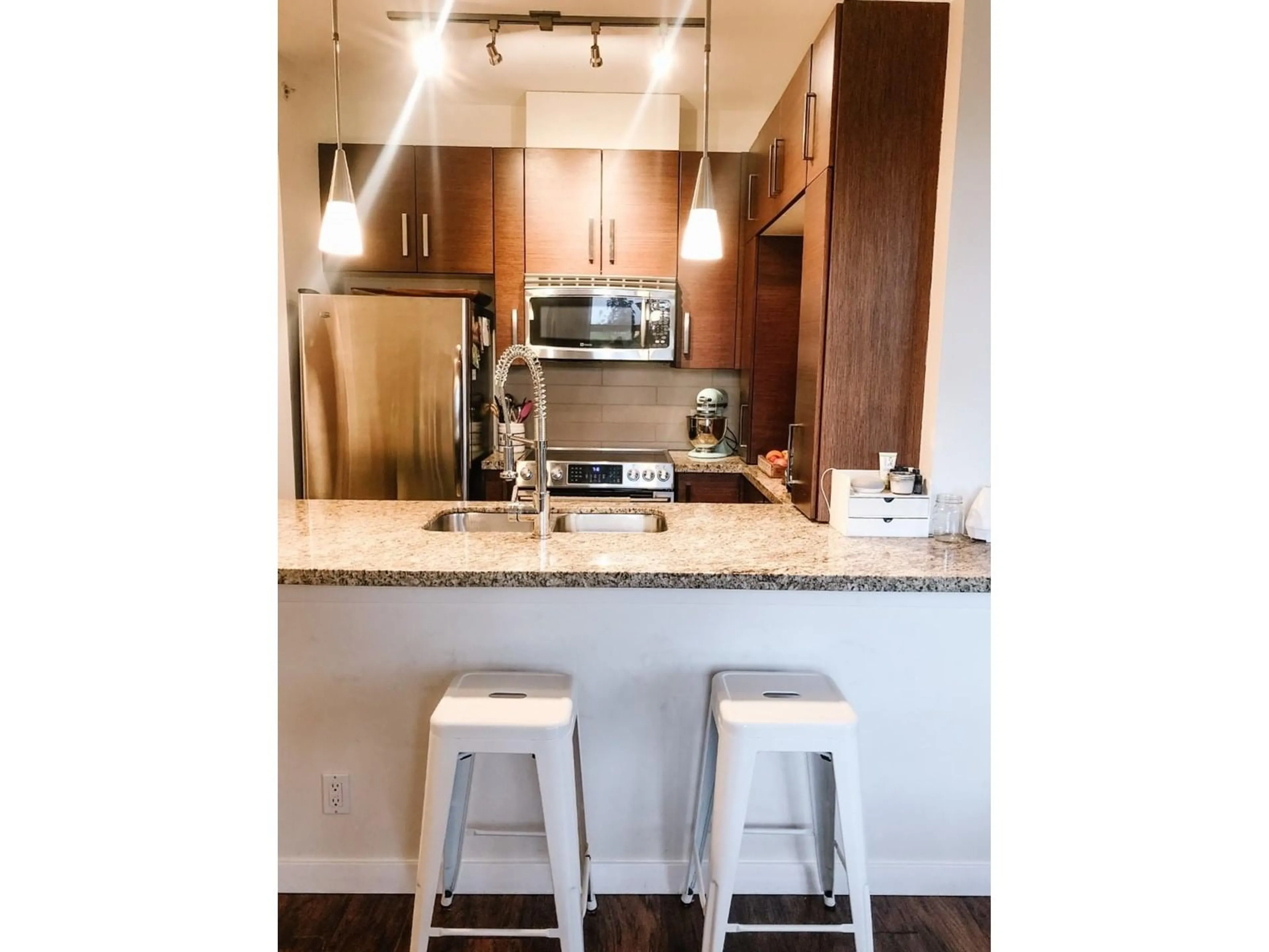 Open concept kitchen, wood/laminate floor for 402 - 15168 19, Surrey British Columbia V4A0A5