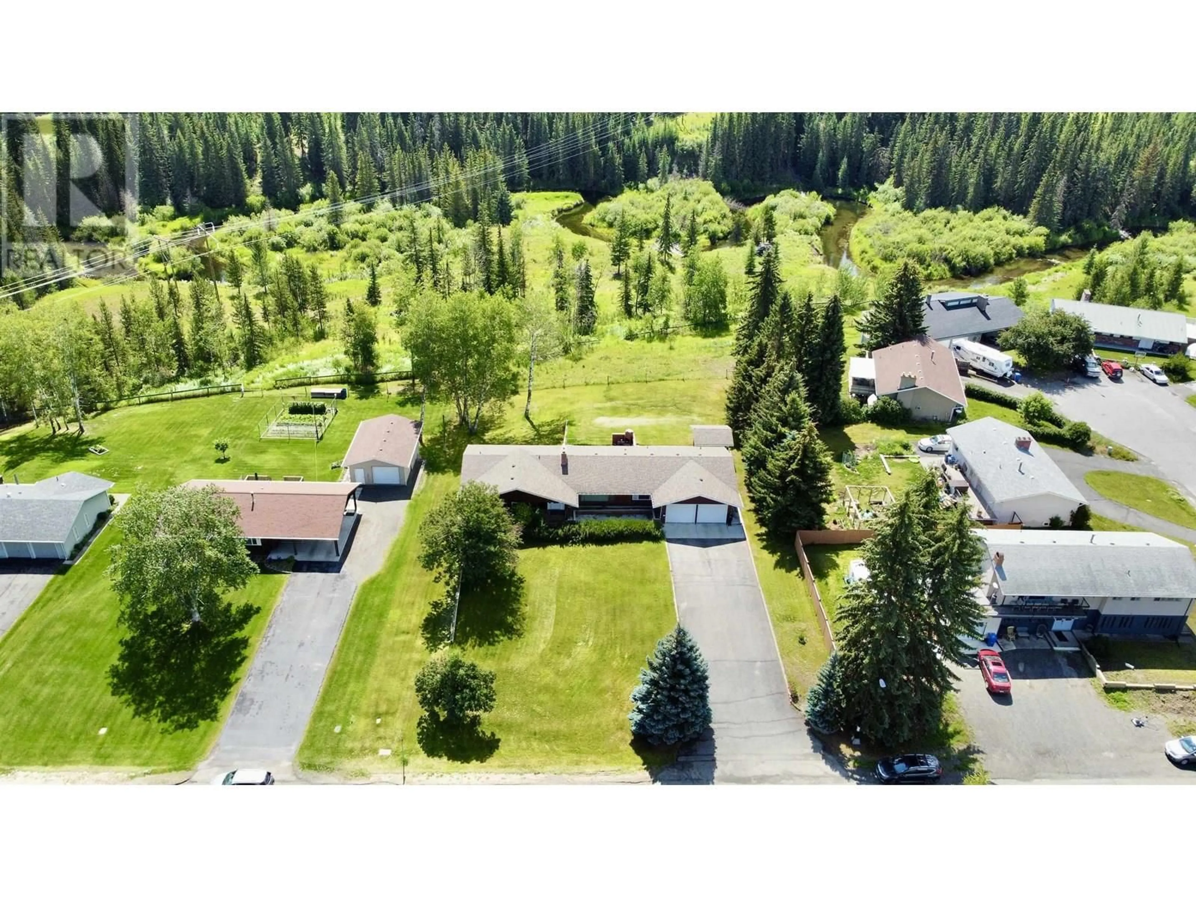 A pic from outside/outdoor area/front of a property/back of a property/a pic from drone, forest/trees view for 355 EVERGREEN CRESCENT, 100 Mile House British Columbia V0K2E0
