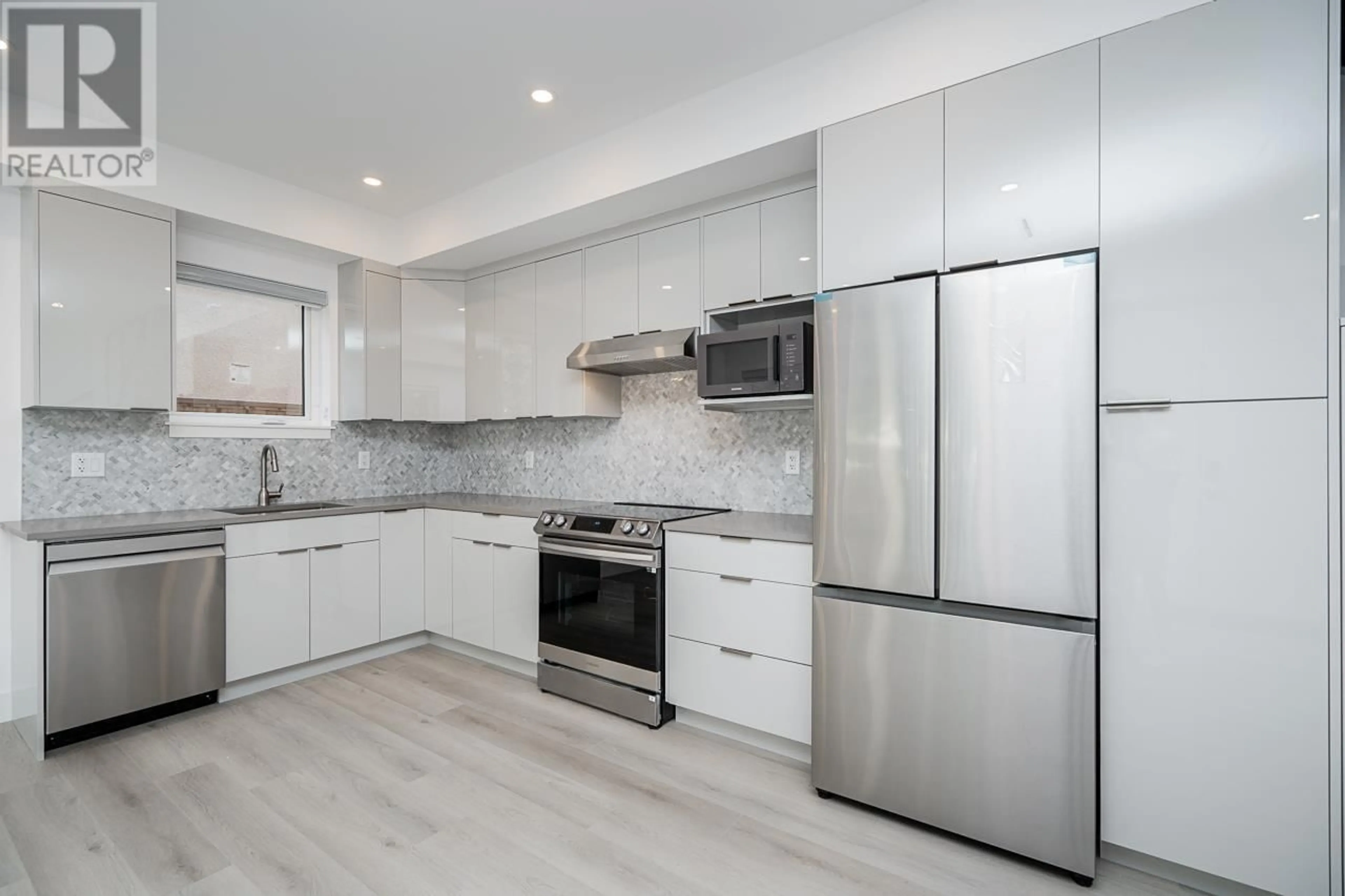 Contemporary kitchen, ceramic/tile floor for 1 - 1936 36TH AVENUE, Vancouver British Columbia V5P1C8