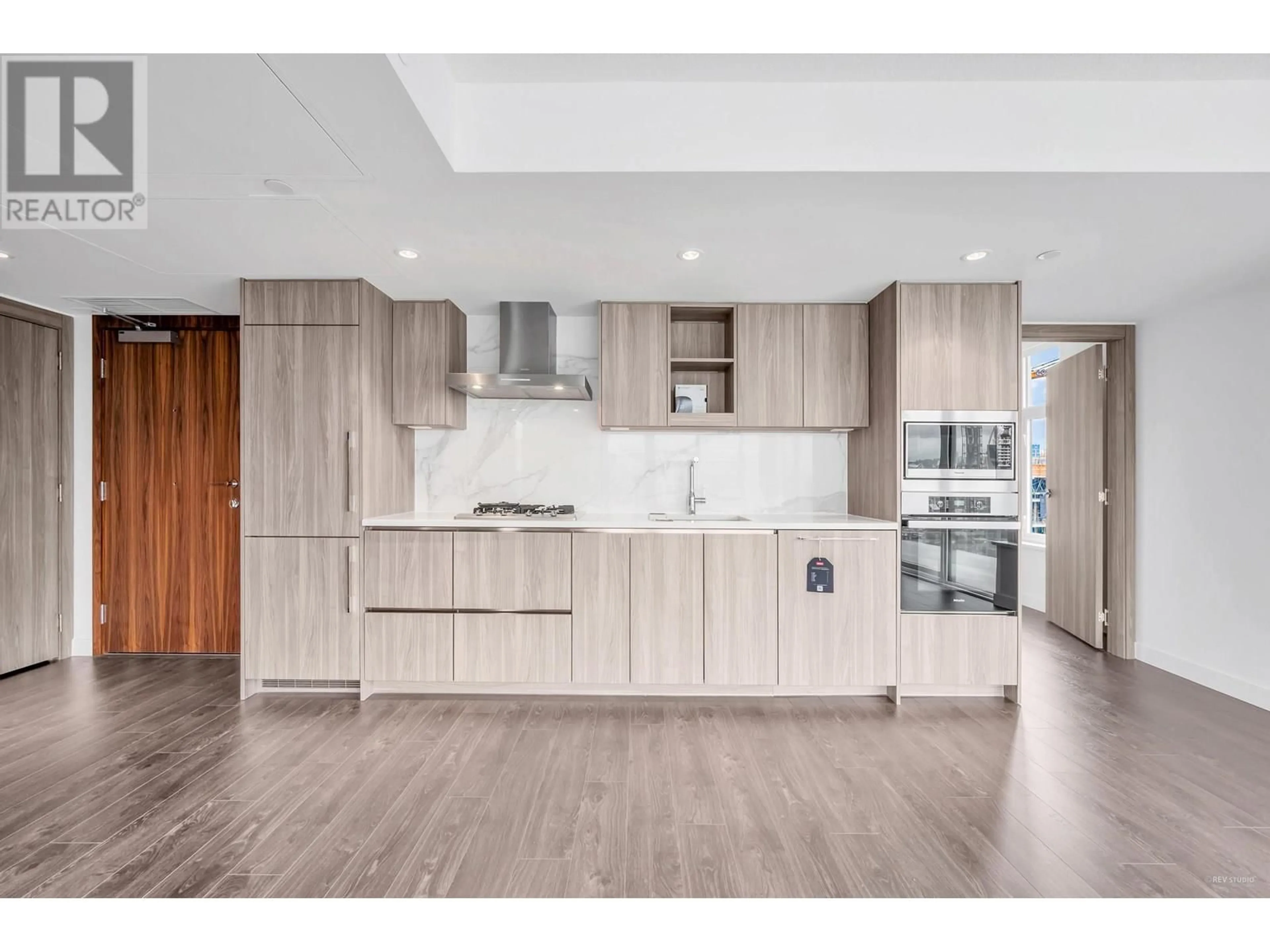 Open concept kitchen, wood/laminate floor for 1385 - 8608 HAZELBRIDGE WAY, Richmond British Columbia V6X0W2