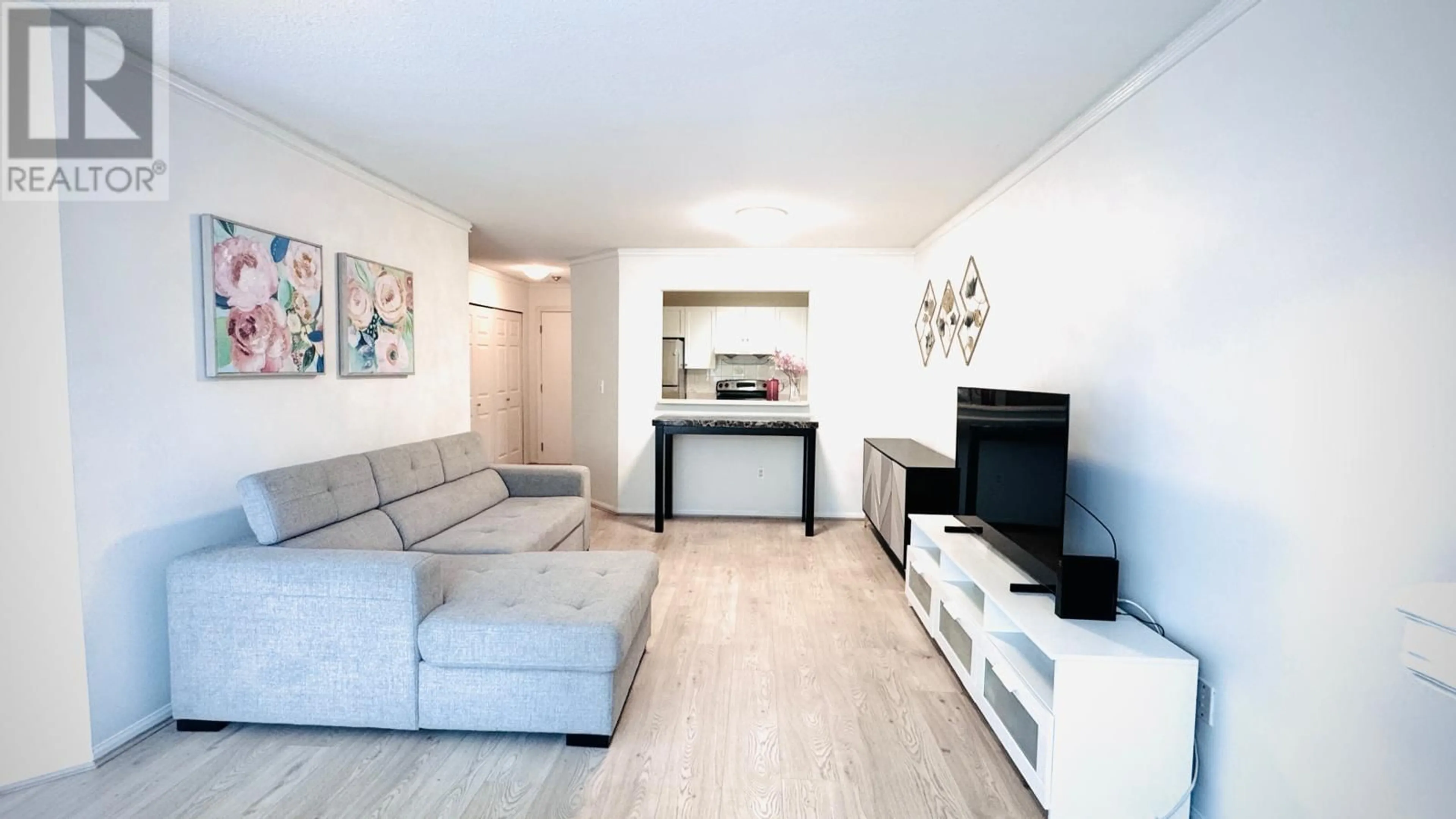 Living room with furniture, wood/laminate floor for 125 - 8751 GENERAL CURRIE ROAD, Richmond British Columbia V6Y3T7