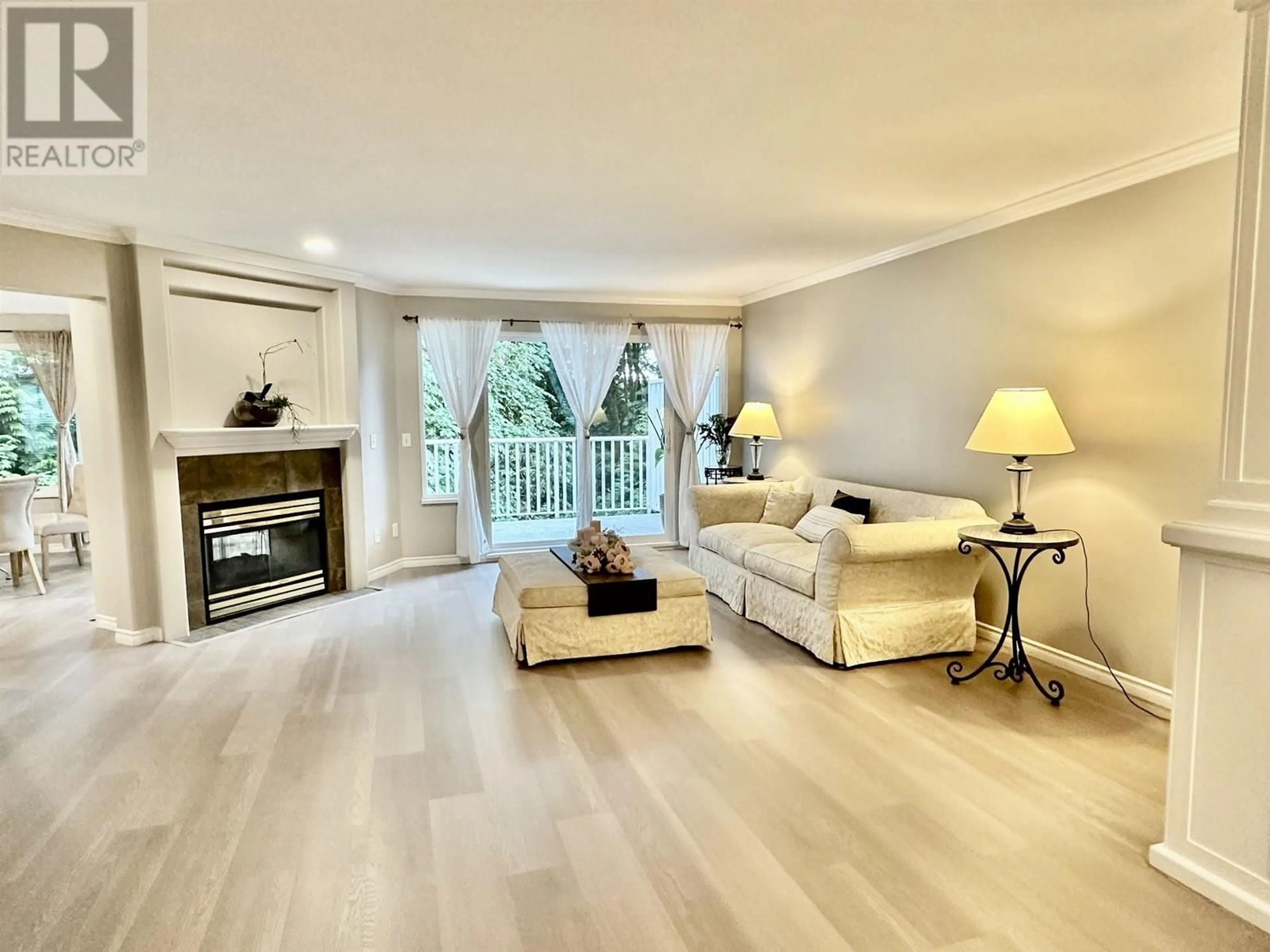 Living room with furniture, wood/laminate floor for 170 - 101 PARKSIDE DRIVE, Port Moody British Columbia V3H4W6