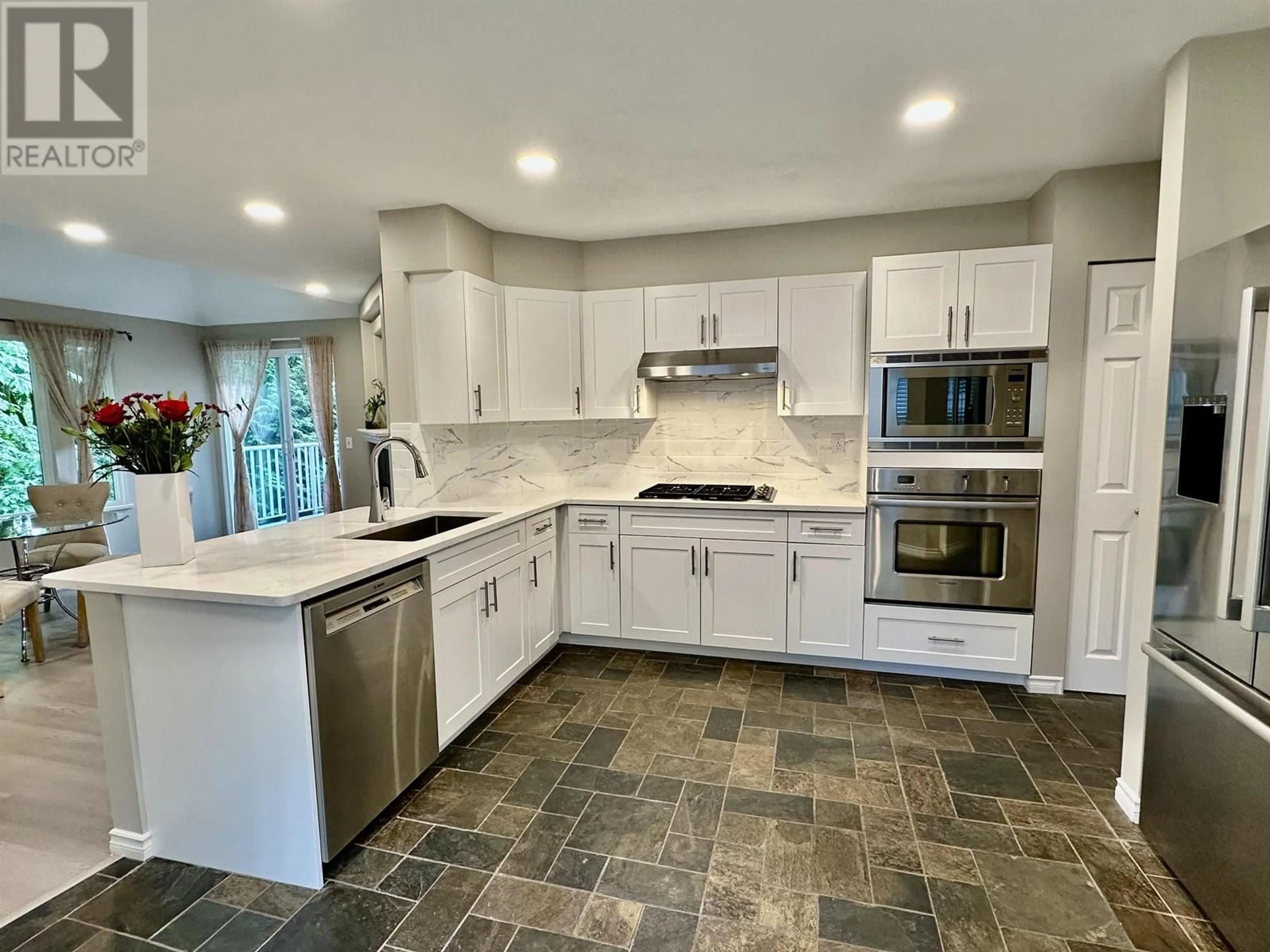 Open concept kitchen, ceramic/tile floor for 170 - 101 PARKSIDE DRIVE, Port Moody British Columbia V3H4W6