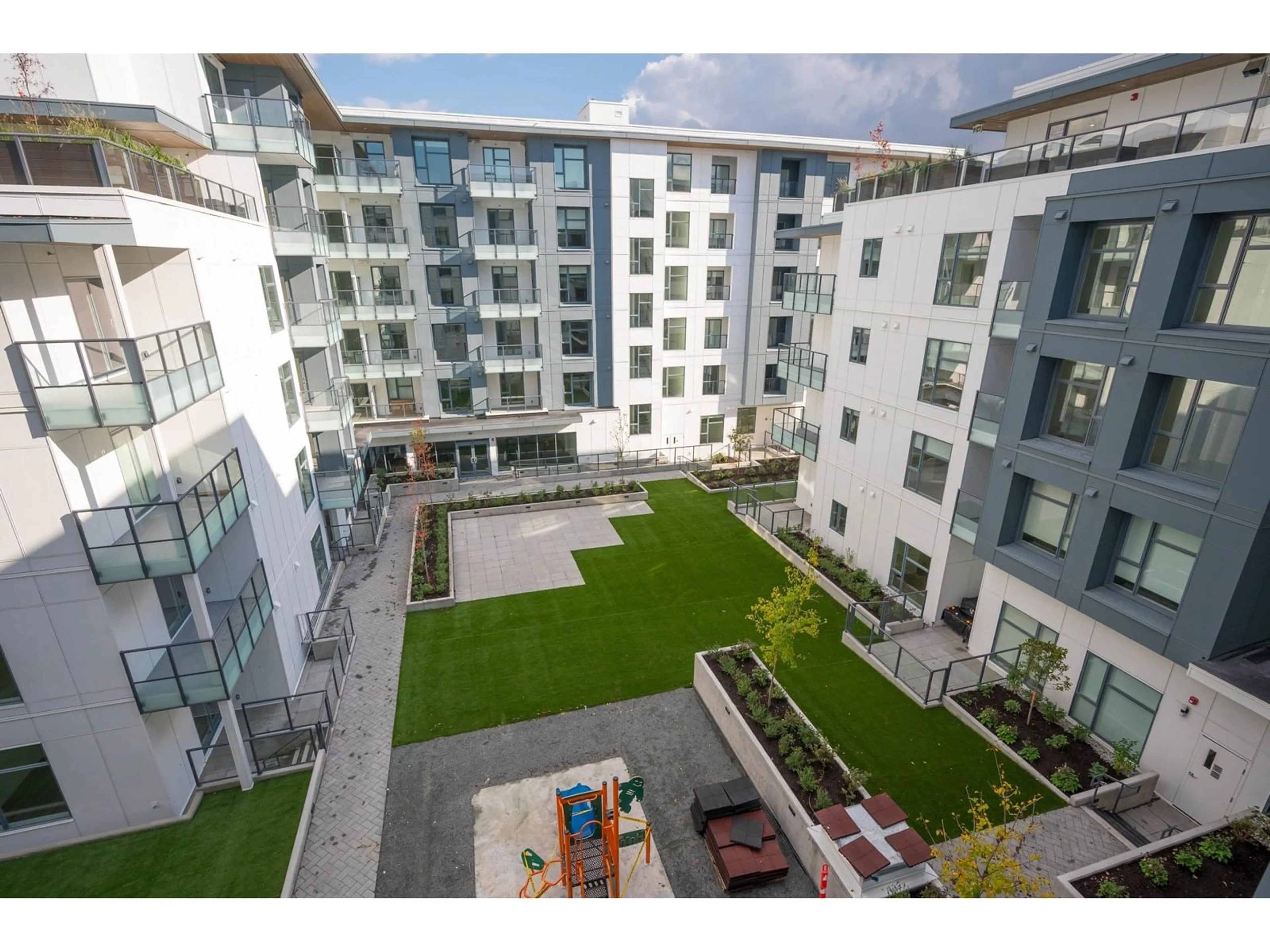 A pic from outside/outdoor area/front of a property/back of a property/a pic from drone, building for E512 - 10829 140, Surrey British Columbia V3R0H4