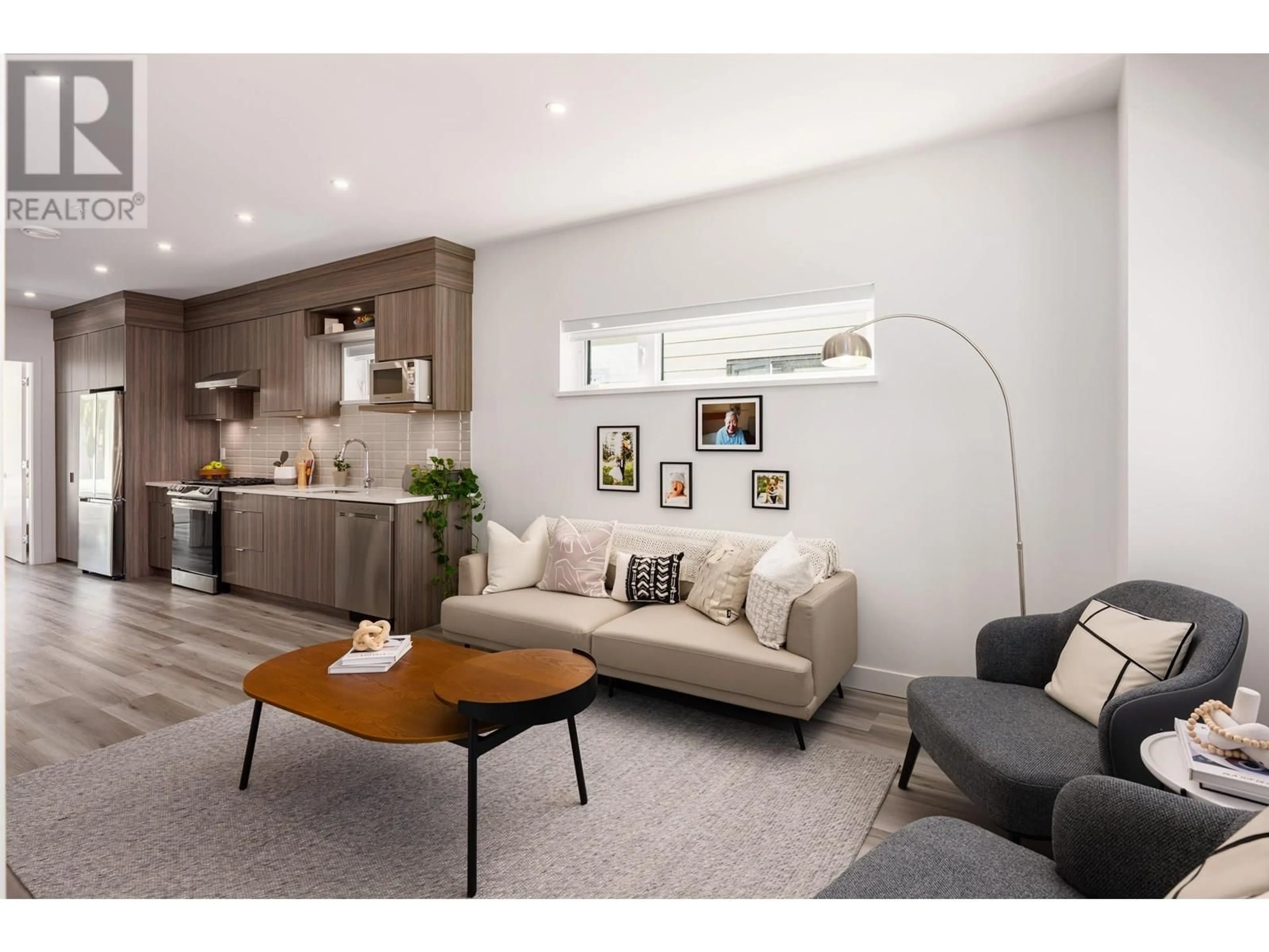 Living room with furniture, wood/laminate floor for 5102 CHAMBERS STREET, Vancouver British Columbia V5R3L9