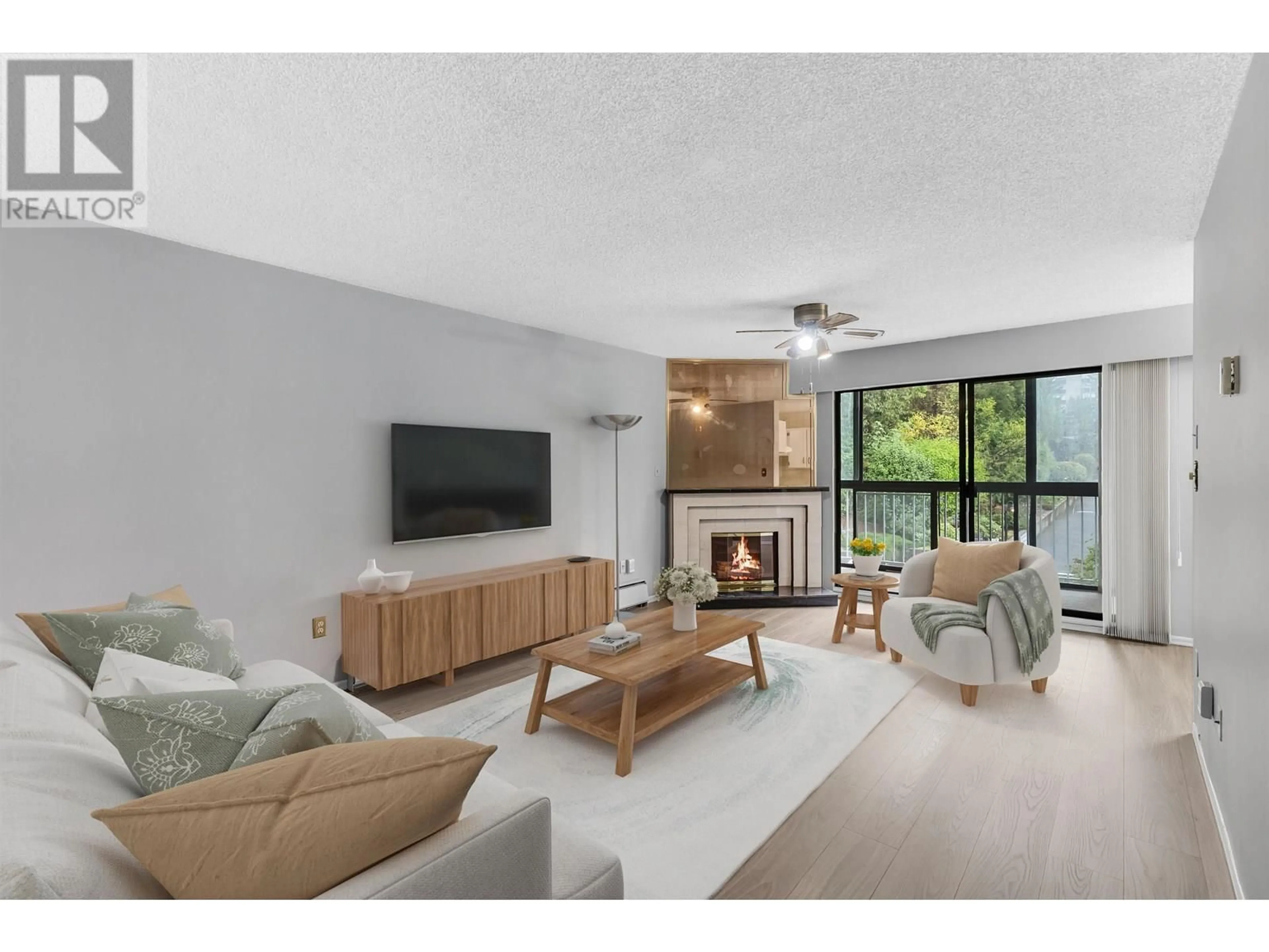 Living room with furniture, unknown for 217 - 3901 CARRIGAN COURT, Burnaby British Columbia V3N4K1
