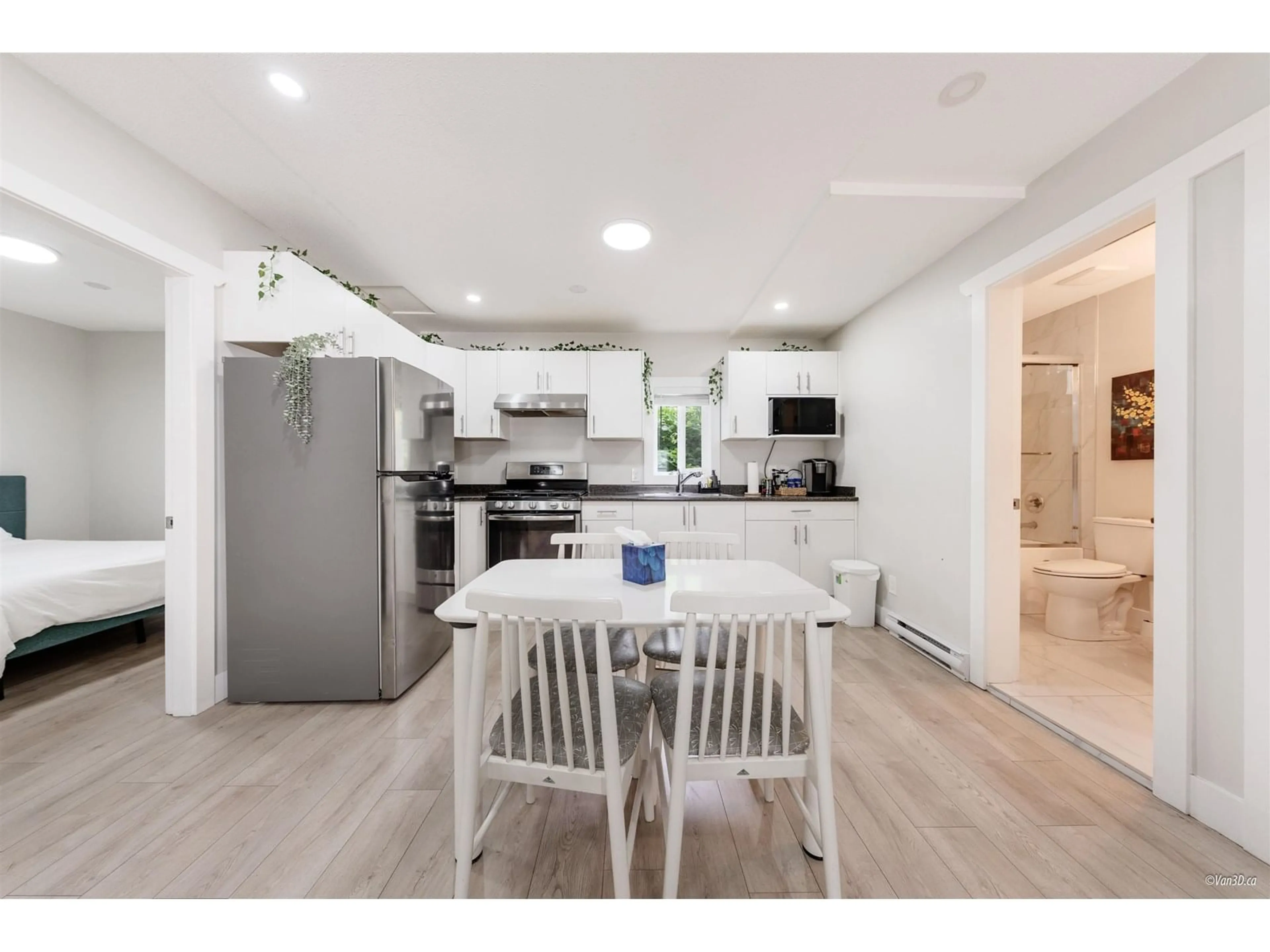Open concept kitchen, wood/laminate floor for 6709 216, Langley British Columbia V2Y0W9