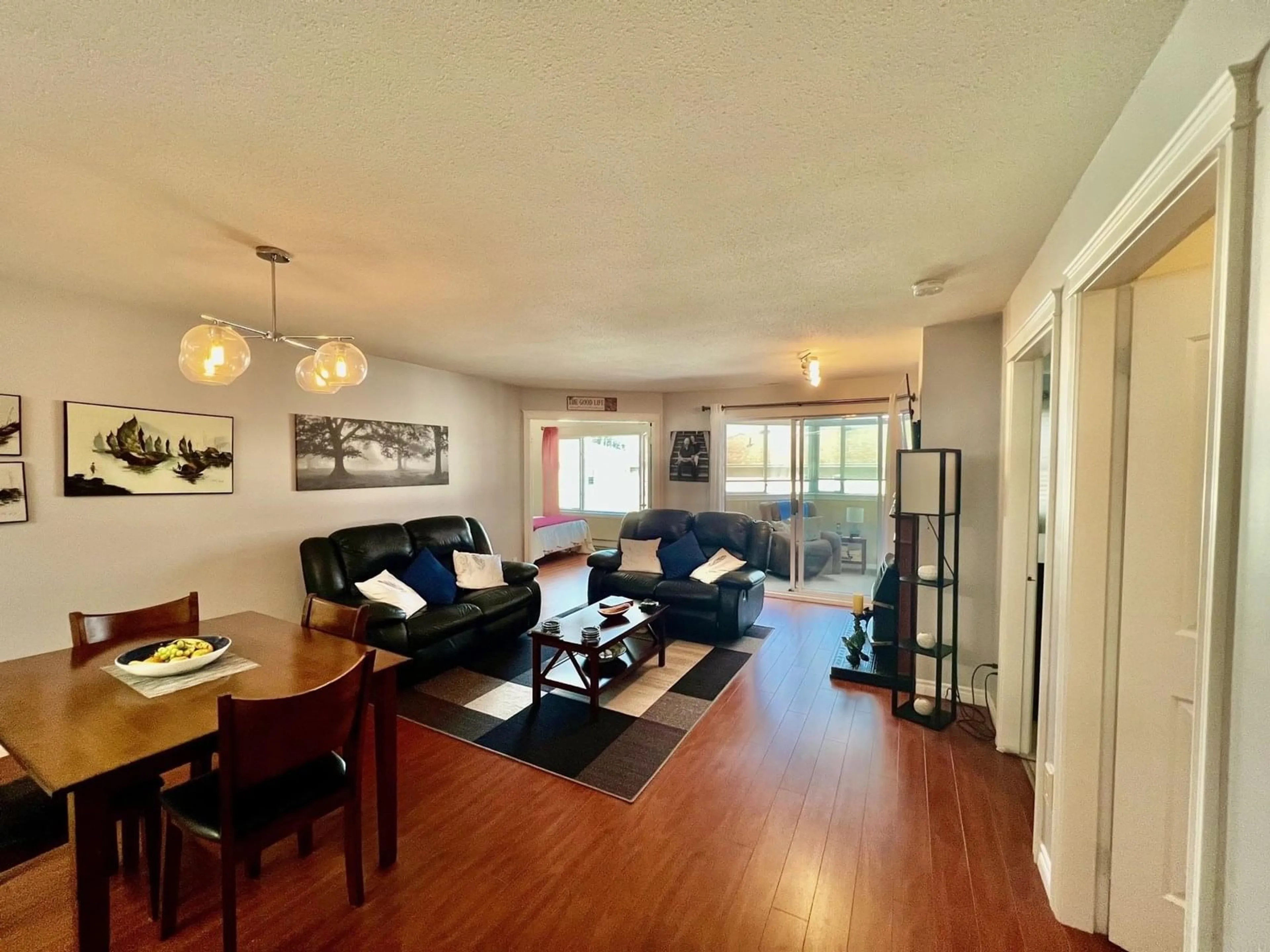 Living room with furniture, wood/laminate floor for 207 - 45660 KNIGHT ROAD, Chilliwack British Columbia V2R2X4