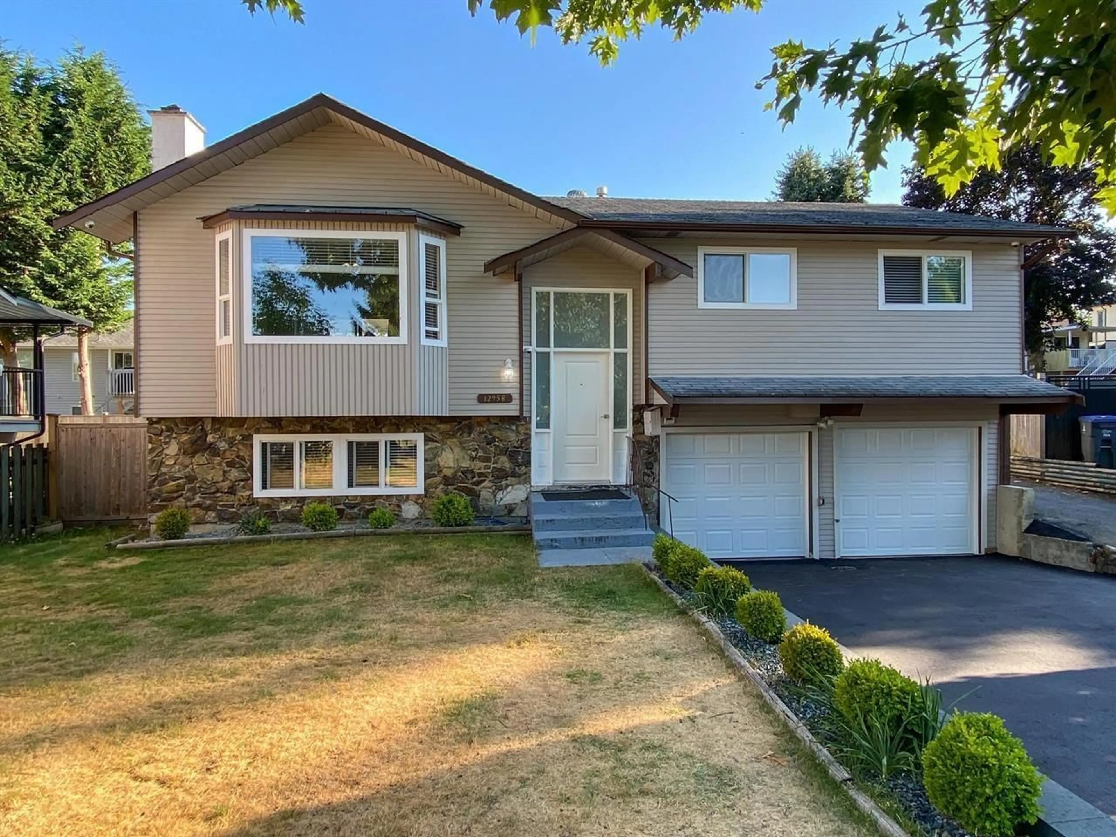 Home with vinyl exterior material, street for 12958 65A, Surrey British Columbia V3W7H7