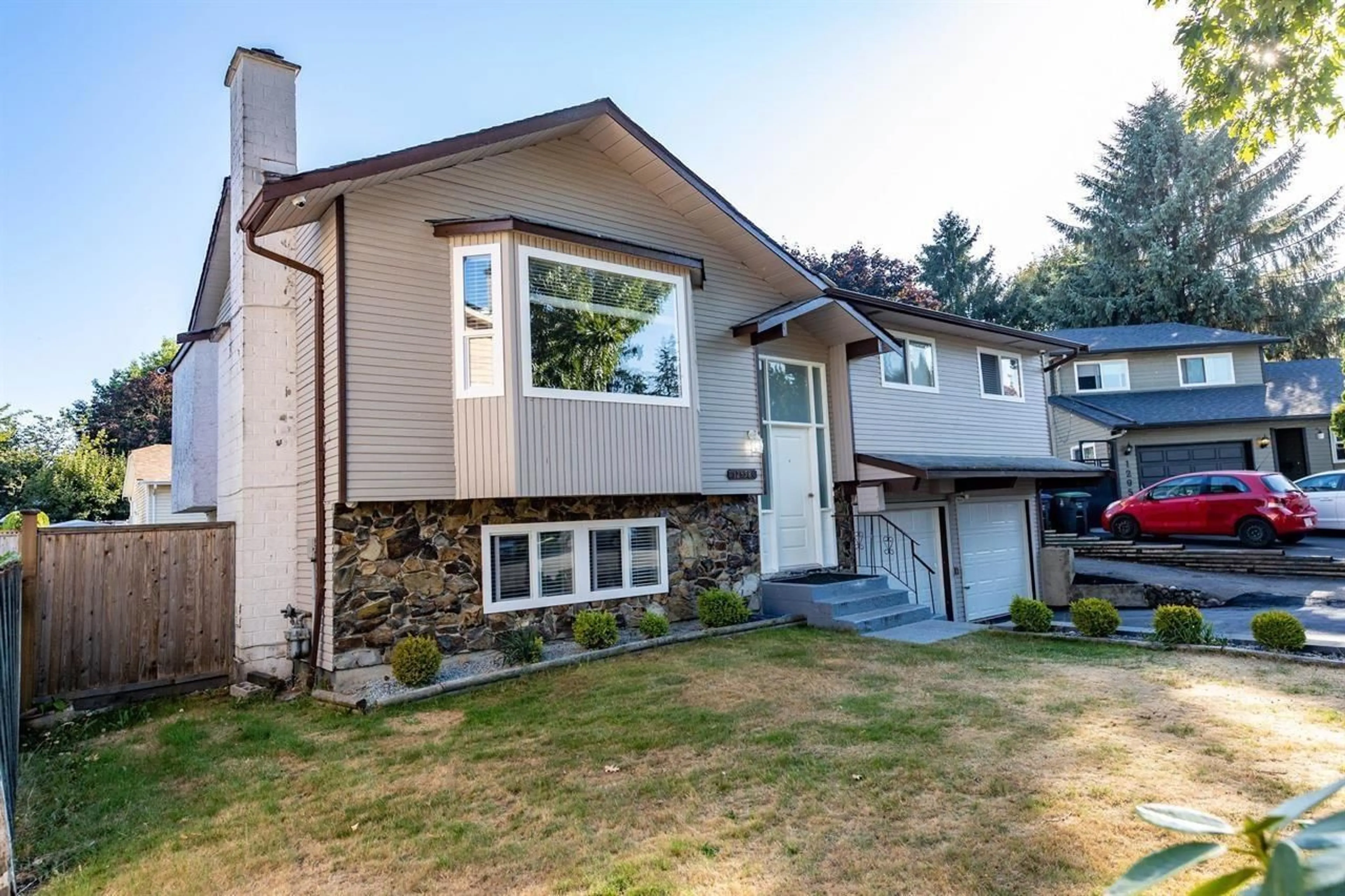 Home with vinyl exterior material, street for 12958 65A, Surrey British Columbia V3W7H7