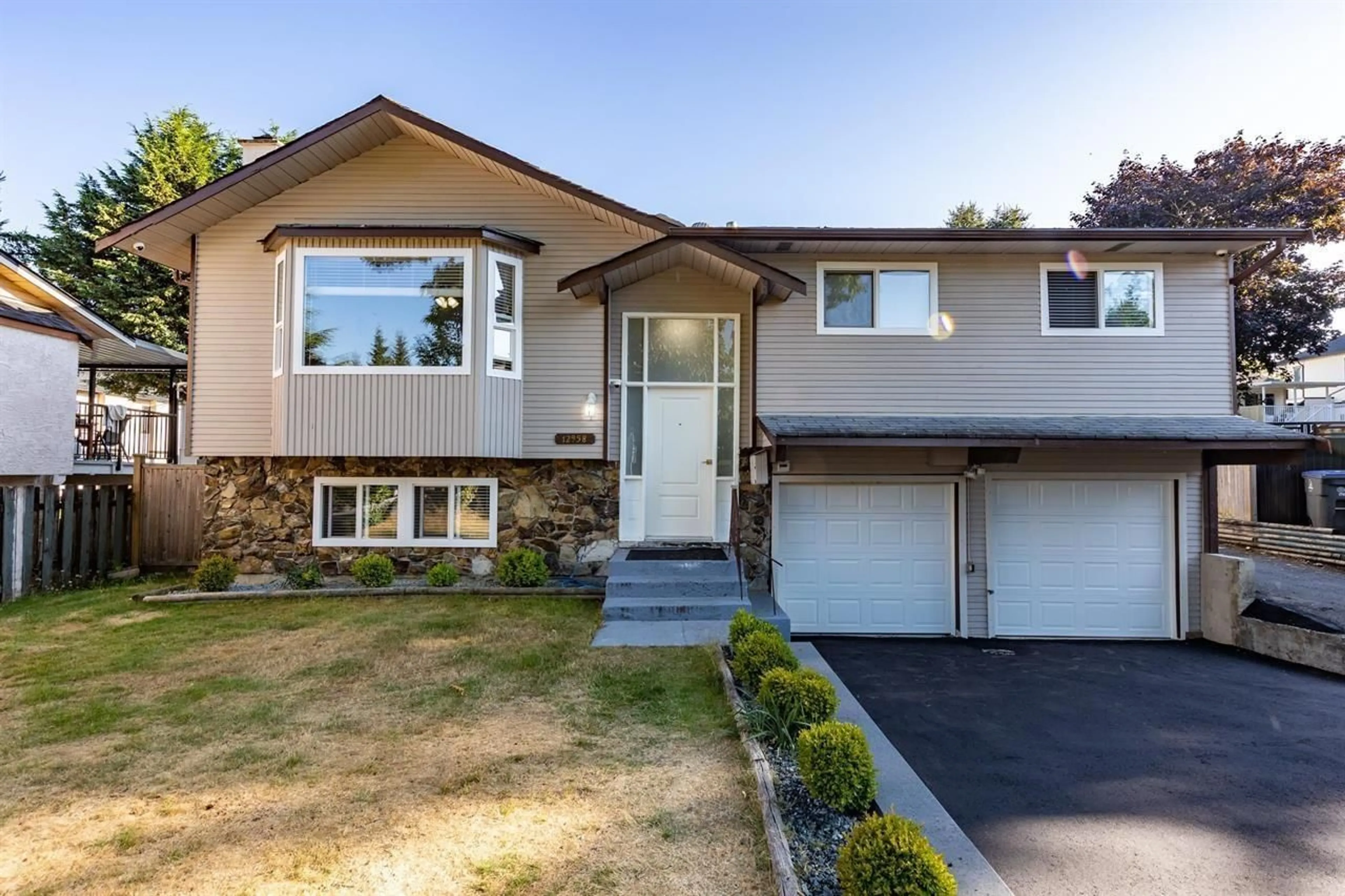 Home with vinyl exterior material, street for 12958 65A, Surrey British Columbia V3W7H7