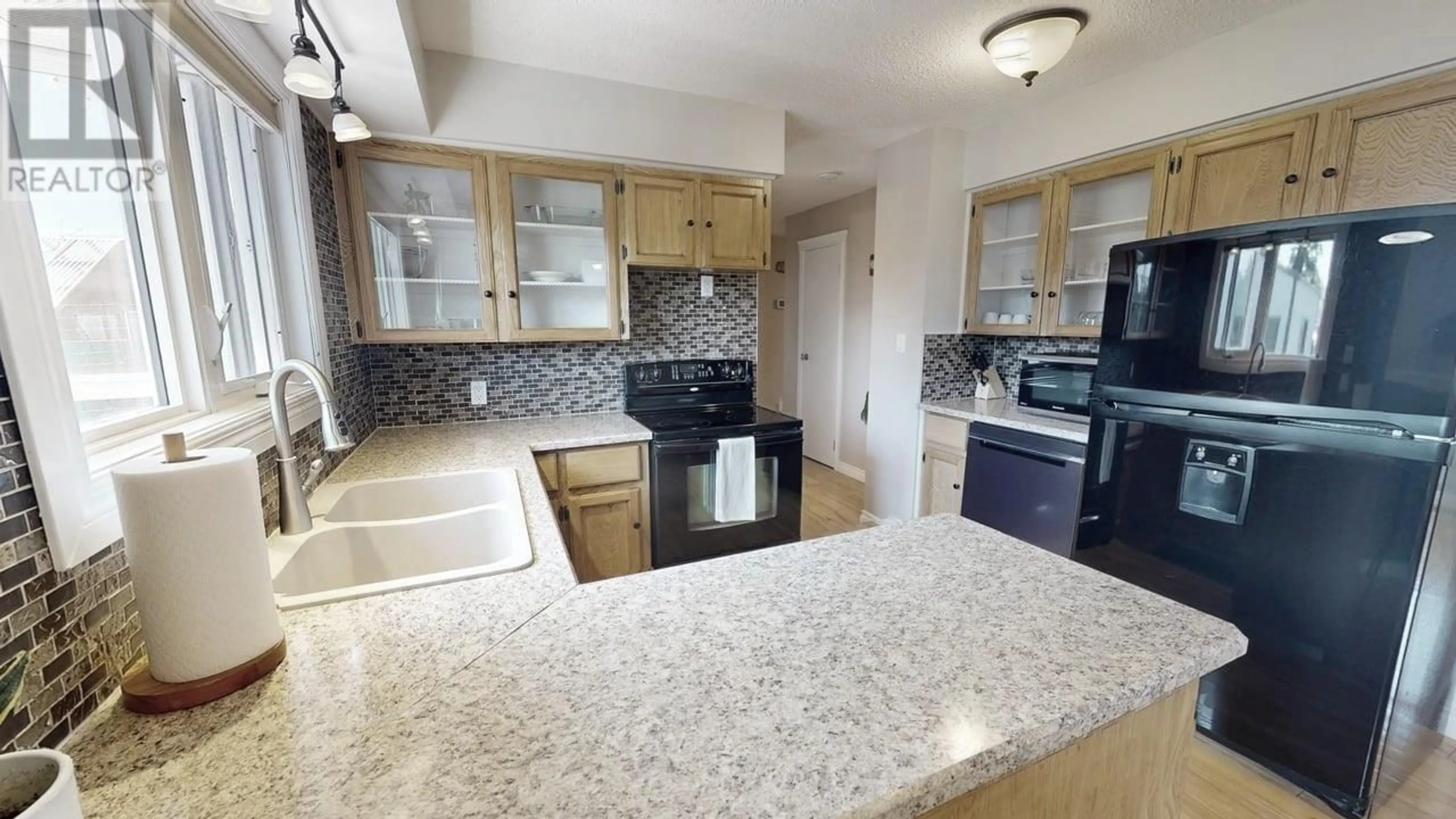 Standard kitchen, ceramic/tile floor for 9803 113 AVENUE, Fort St. John British Columbia V1J4P7