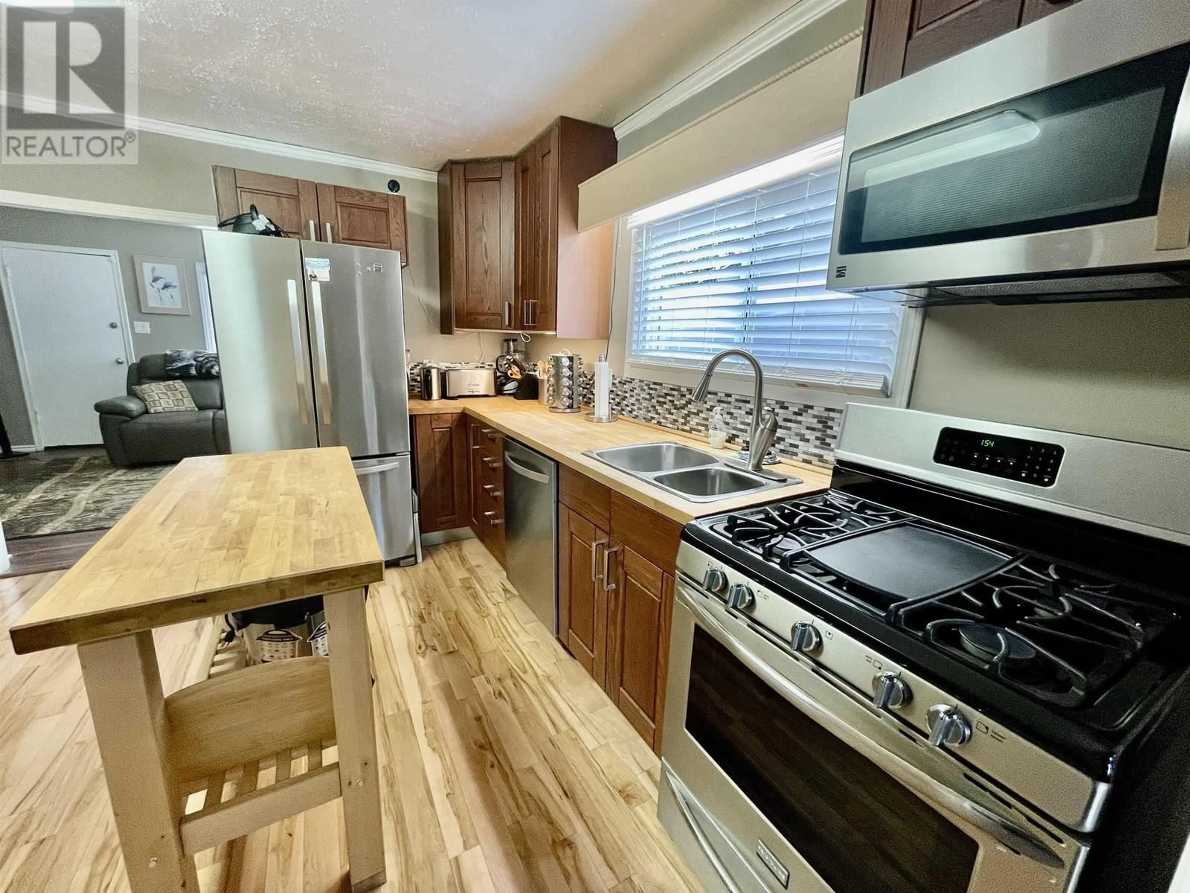 Open concept kitchen, unknown for 8319 94 AVENUE, Fort St. John British Columbia V1J1E7