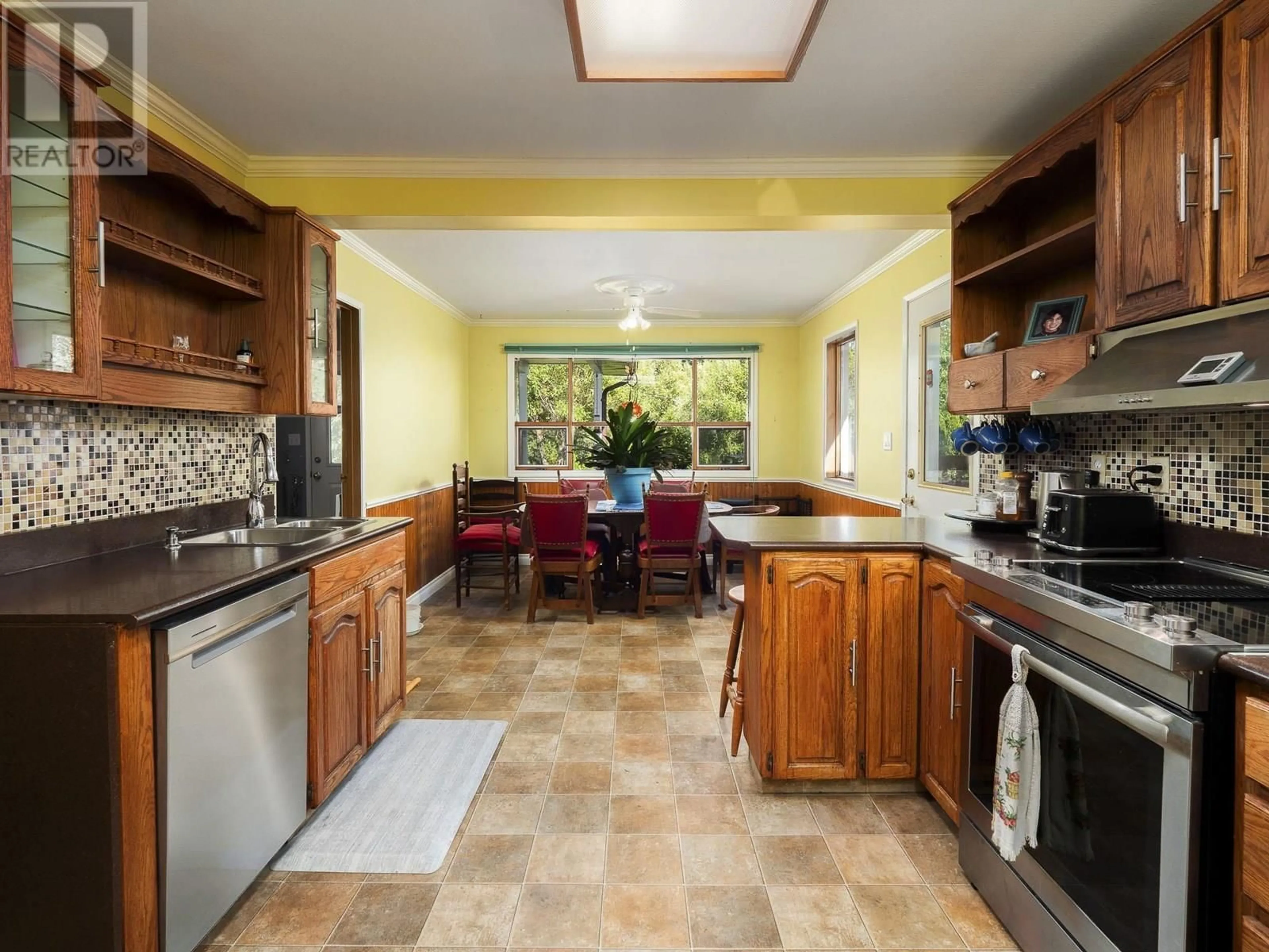 Open concept kitchen, ceramic/tile floor for 2246 NORTHWOOD PULPMILL ROAD, Prince George British Columbia V2K1K2