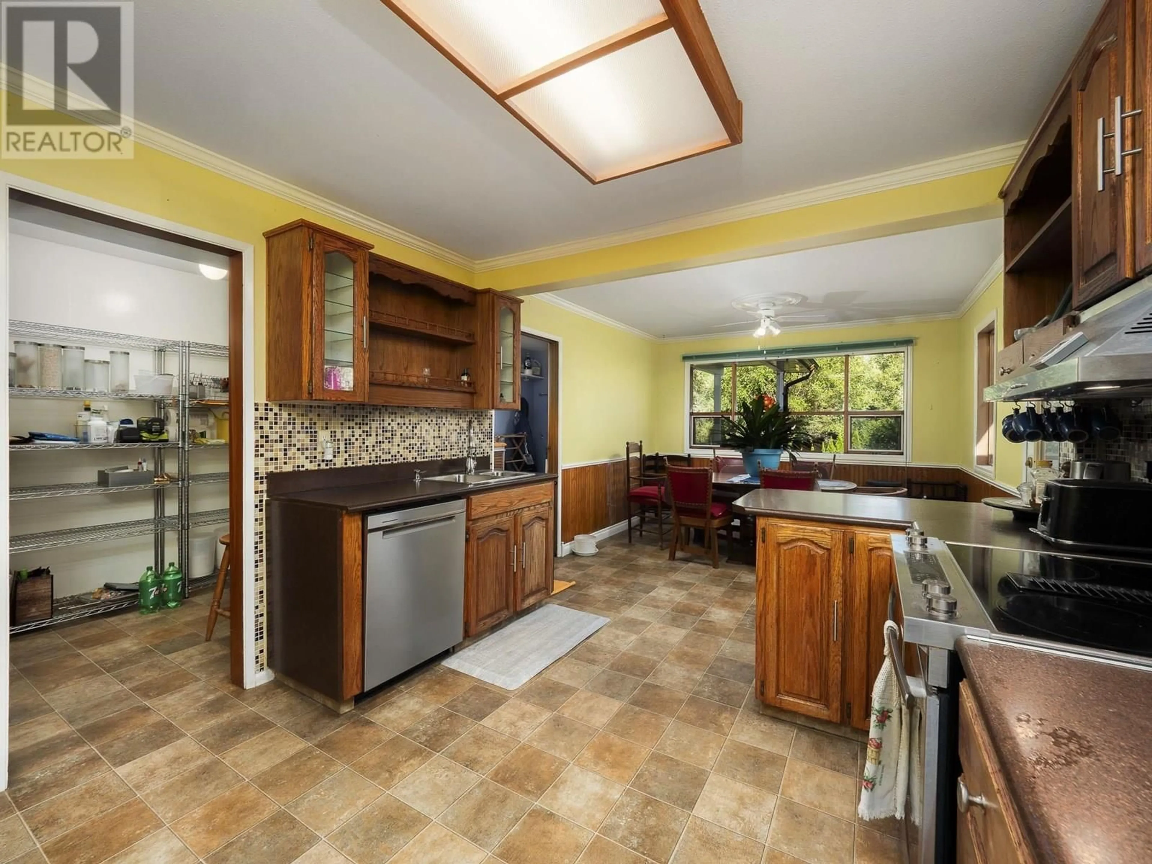 Open concept kitchen, ceramic/tile floor for 2246 NORTHWOOD PULPMILL ROAD, Prince George British Columbia V2K1K2