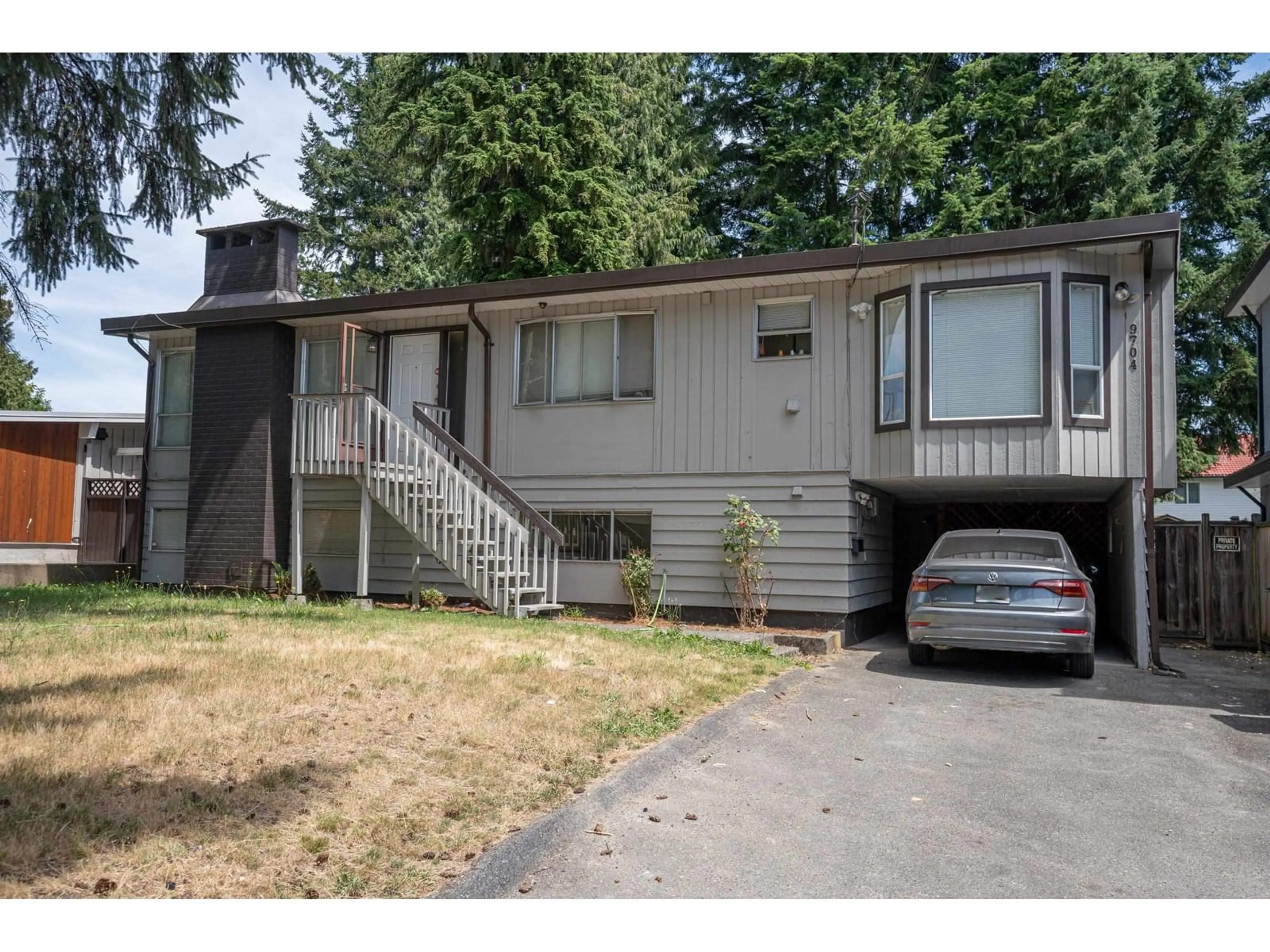 Home with vinyl exterior material, street for 9704 131, Surrey British Columbia V3T3P3