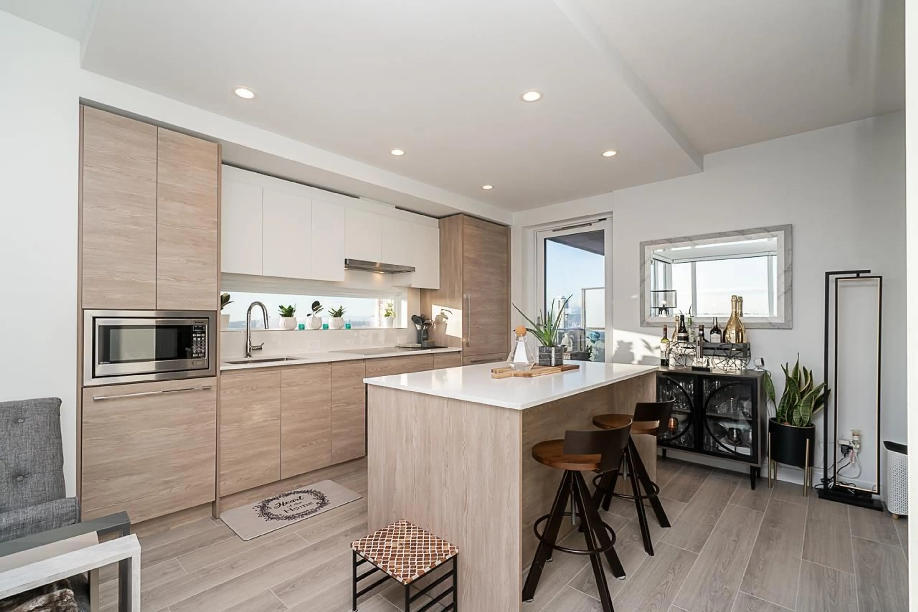 Open concept kitchen, wood/laminate floor for 3003 - 13615 FRASER, Surrey British Columbia V3T0P7