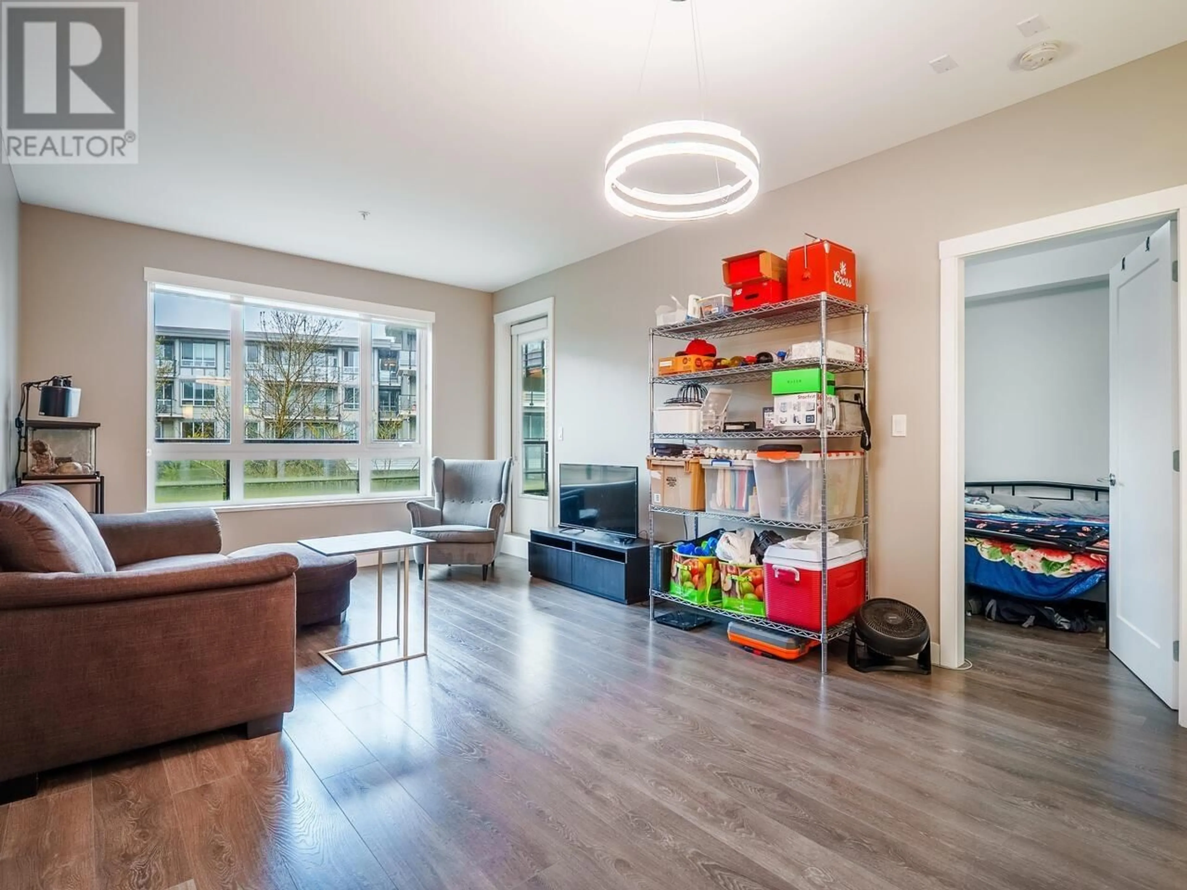Living room with furniture, wood/laminate floor for 220 - 23233 GILLEY ROAD, Richmond British Columbia V6V1E6