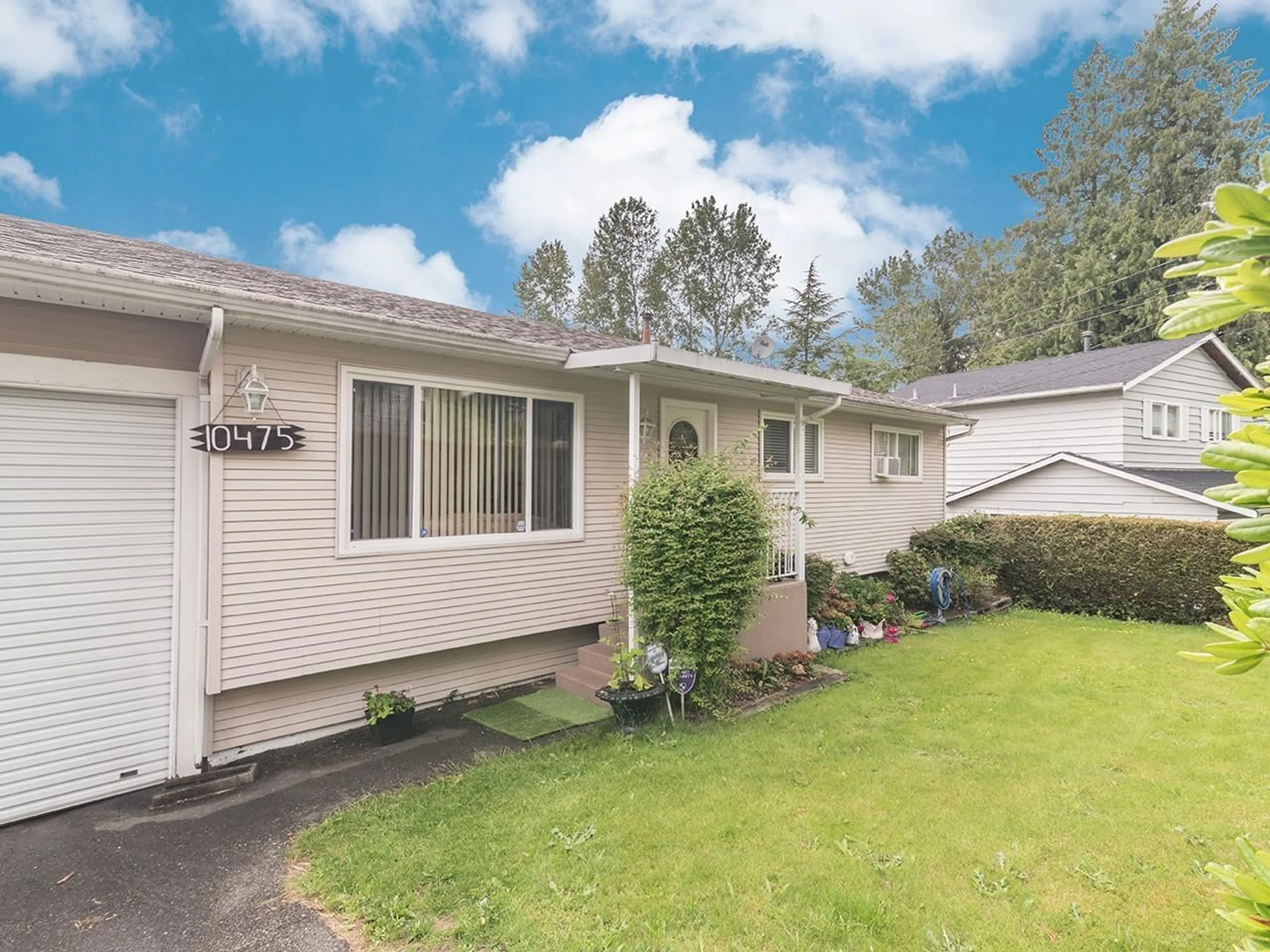 Home with vinyl exterior material, street for 10475 125, Surrey British Columbia V3V4Y9