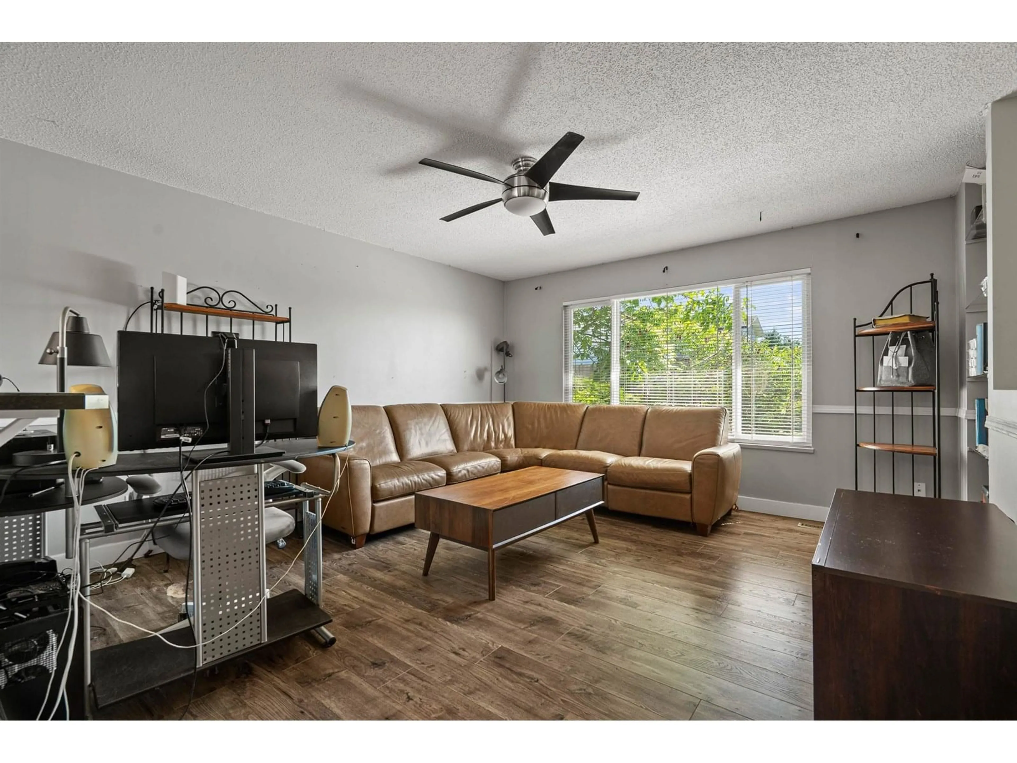 Living room with furniture, wood/laminate floor for 8129 BOBCAT, Mission British Columbia V2V5J7
