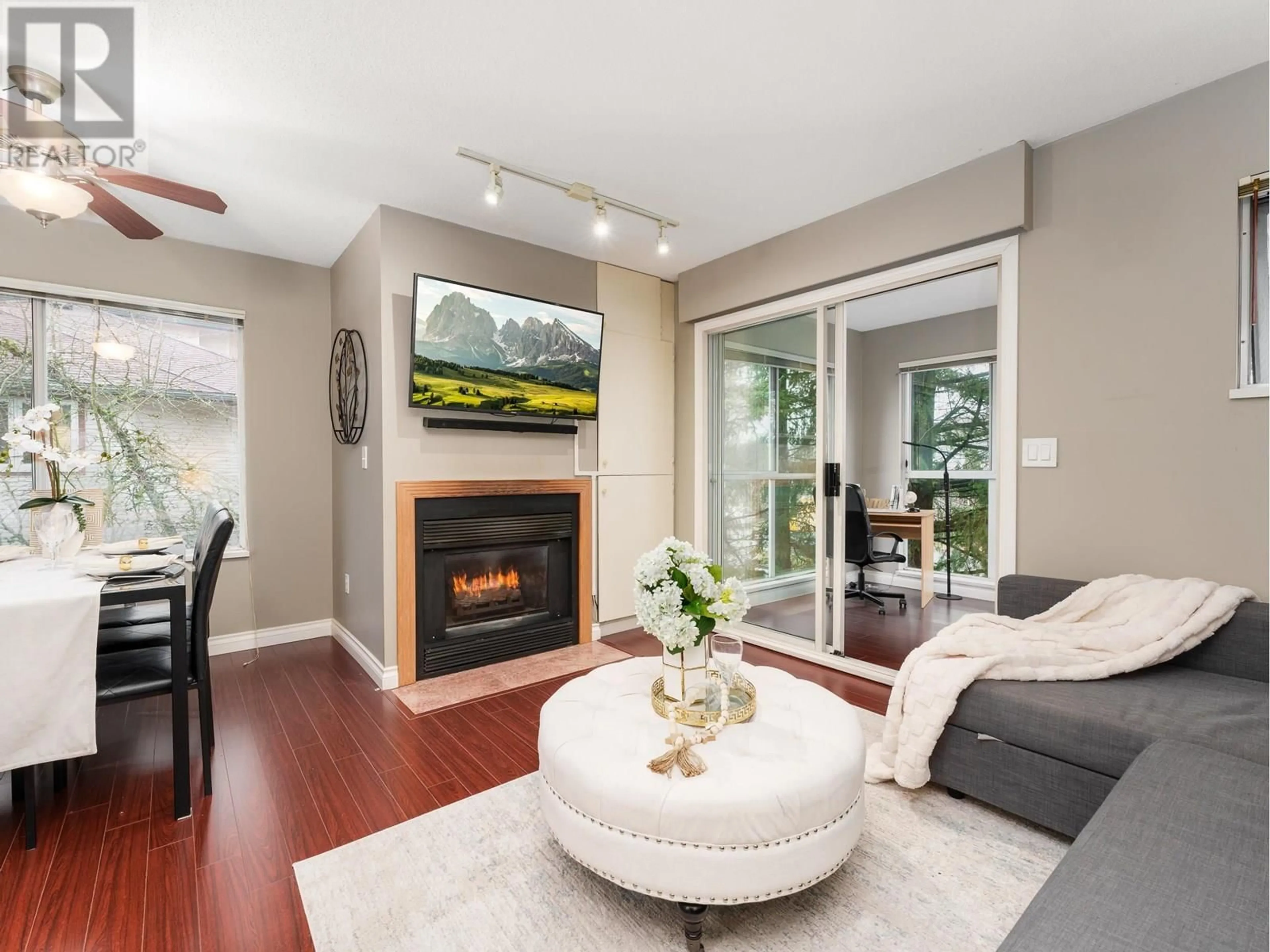 Living room with furniture, wood/laminate floor for 303 - 3683 WELLINGTON AVENUE, Vancouver British Columbia V5R4Z5
