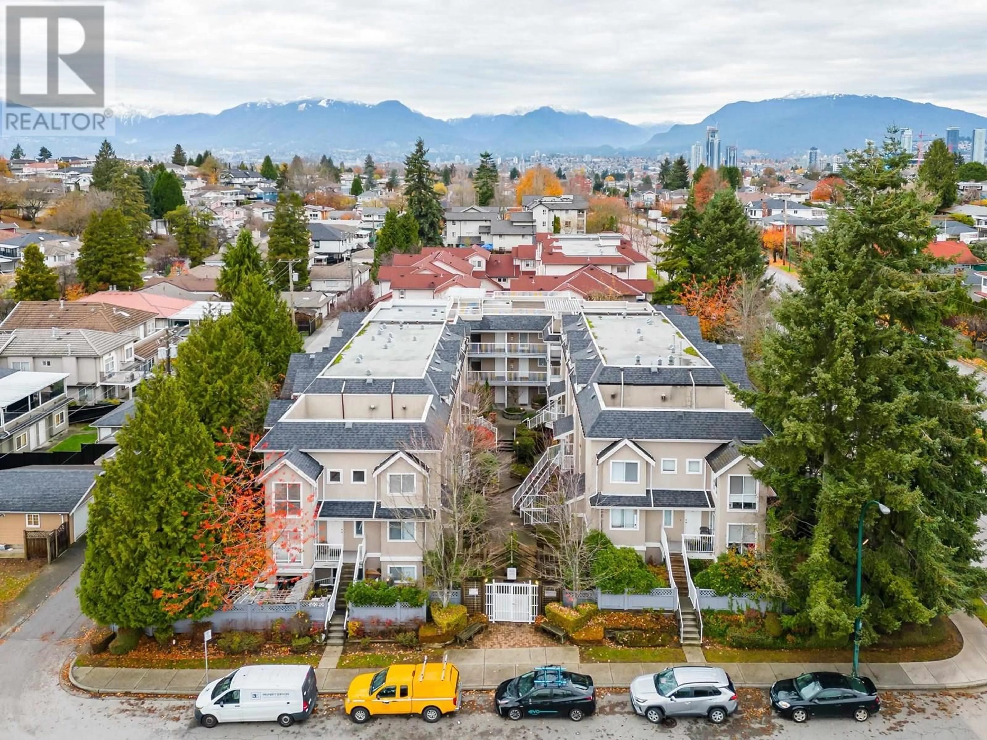 A pic from outside/outdoor area/front of a property/back of a property/a pic from drone, mountain view for 303 - 3683 WELLINGTON AVENUE, Vancouver British Columbia V5R4Z5