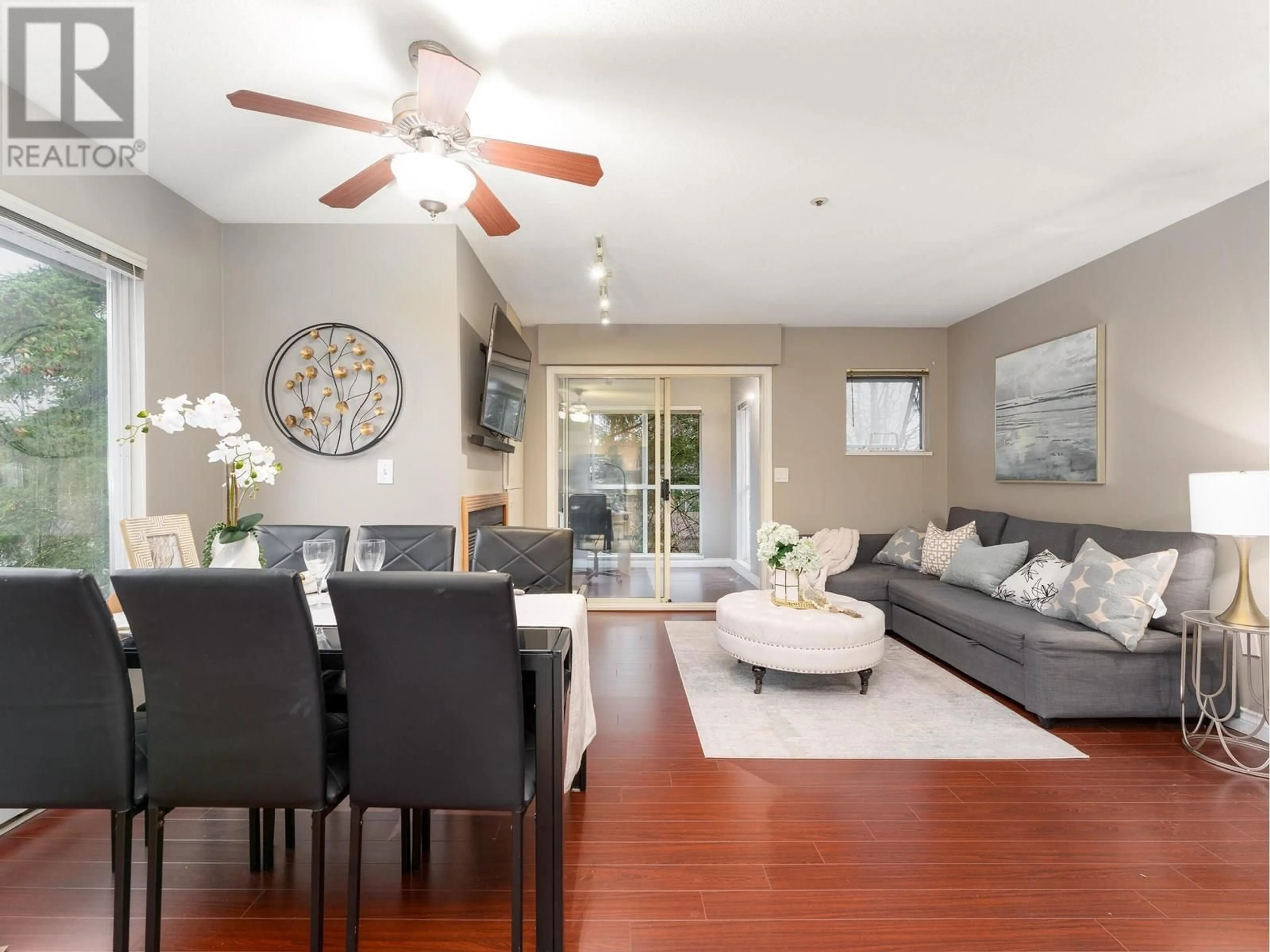 Living room with furniture, wood/laminate floor for 303 - 3683 WELLINGTON AVENUE, Vancouver British Columbia V5R4Z5
