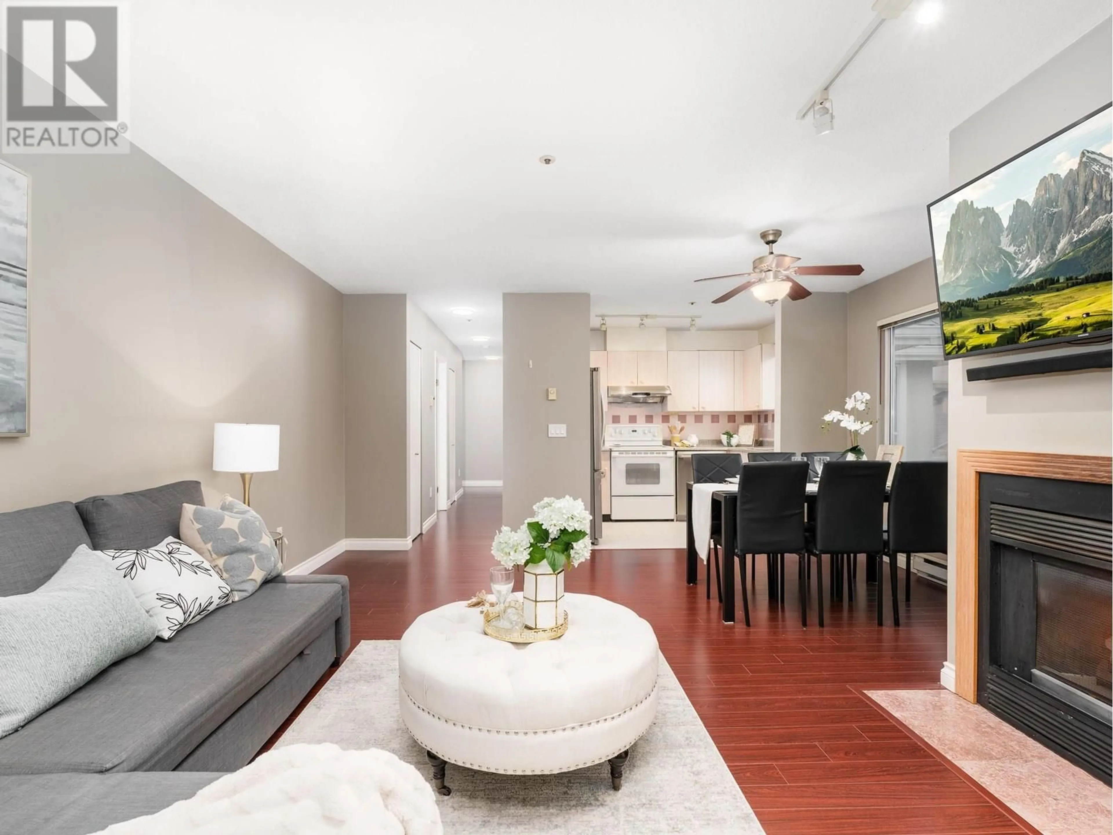 Living room with furniture, wood/laminate floor for 303 - 3683 WELLINGTON AVENUE, Vancouver British Columbia V5R4Z5