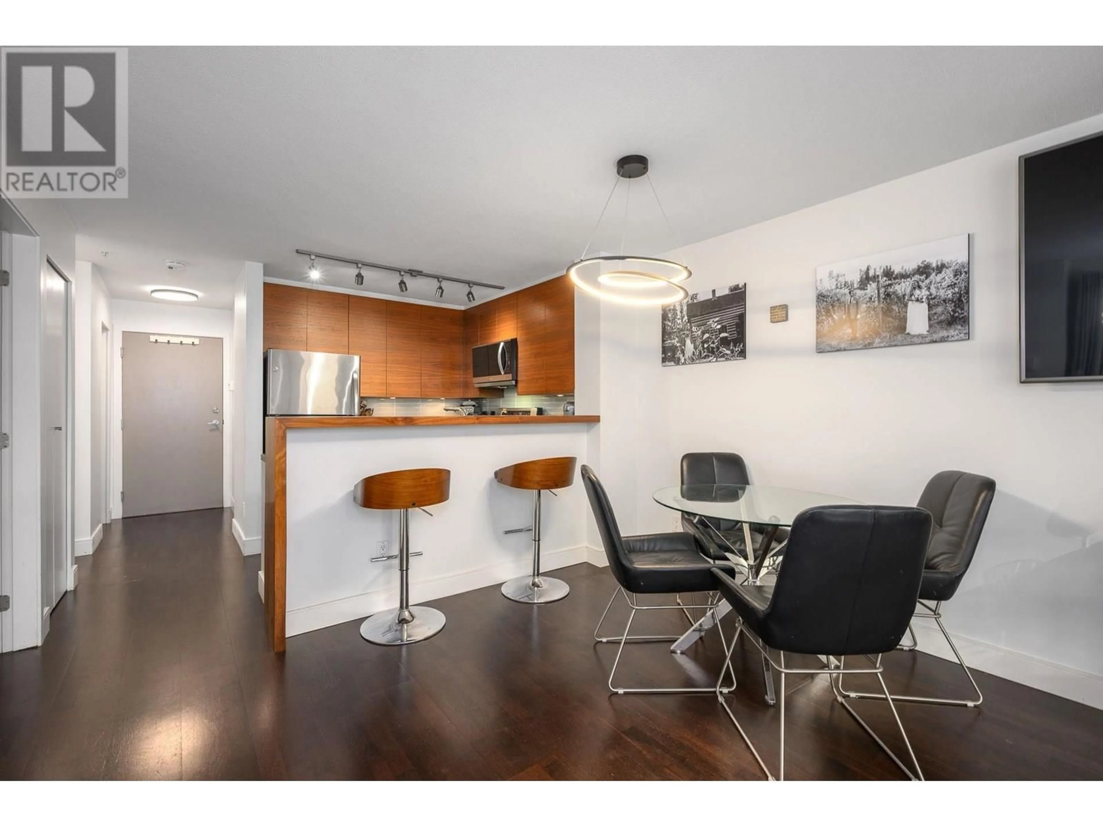 Open concept kitchen, wood/laminate floor for 204 - 124 3RD STREET, North Vancouver British Columbia V7M1E8