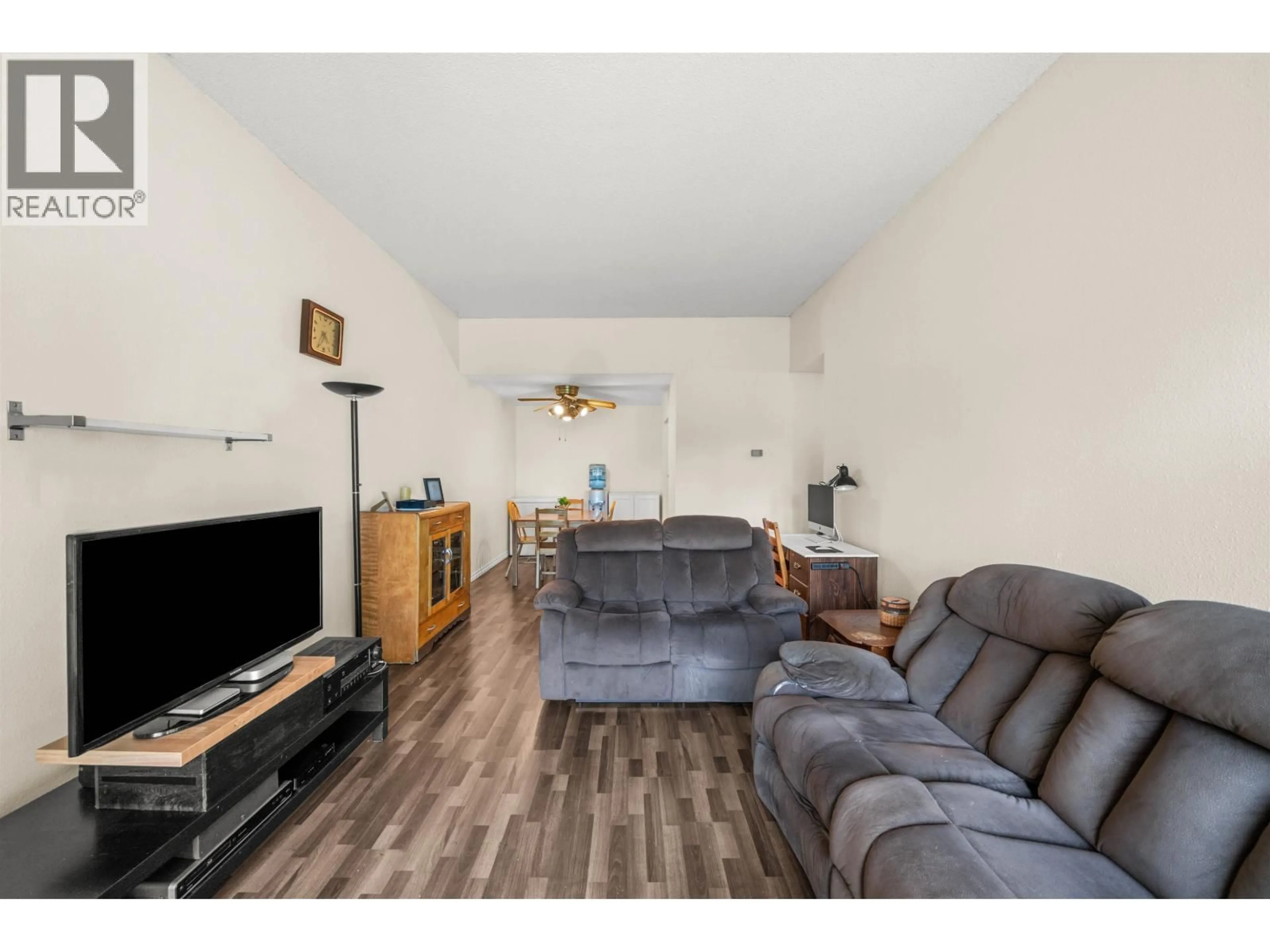 Living room with furniture, wood/laminate floor for 312 - 3451 SPRINGFIELD DRIVE, Richmond British Columbia V7E1Z2