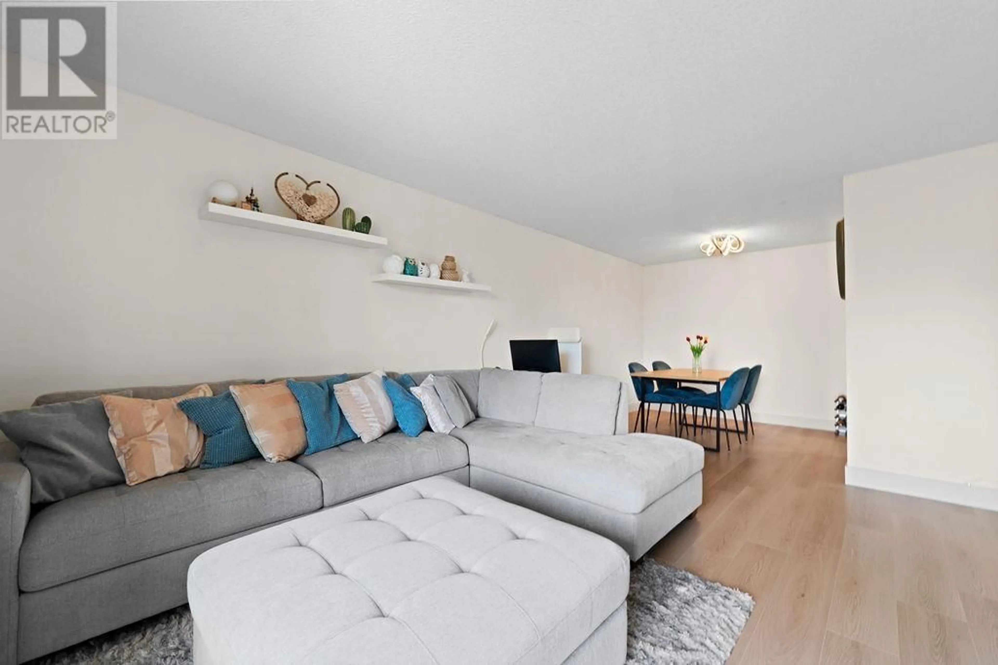 Living room with furniture, wood/laminate floor for 303 - 8870 CITATION DRIVE, Richmond British Columbia V6Y3A3