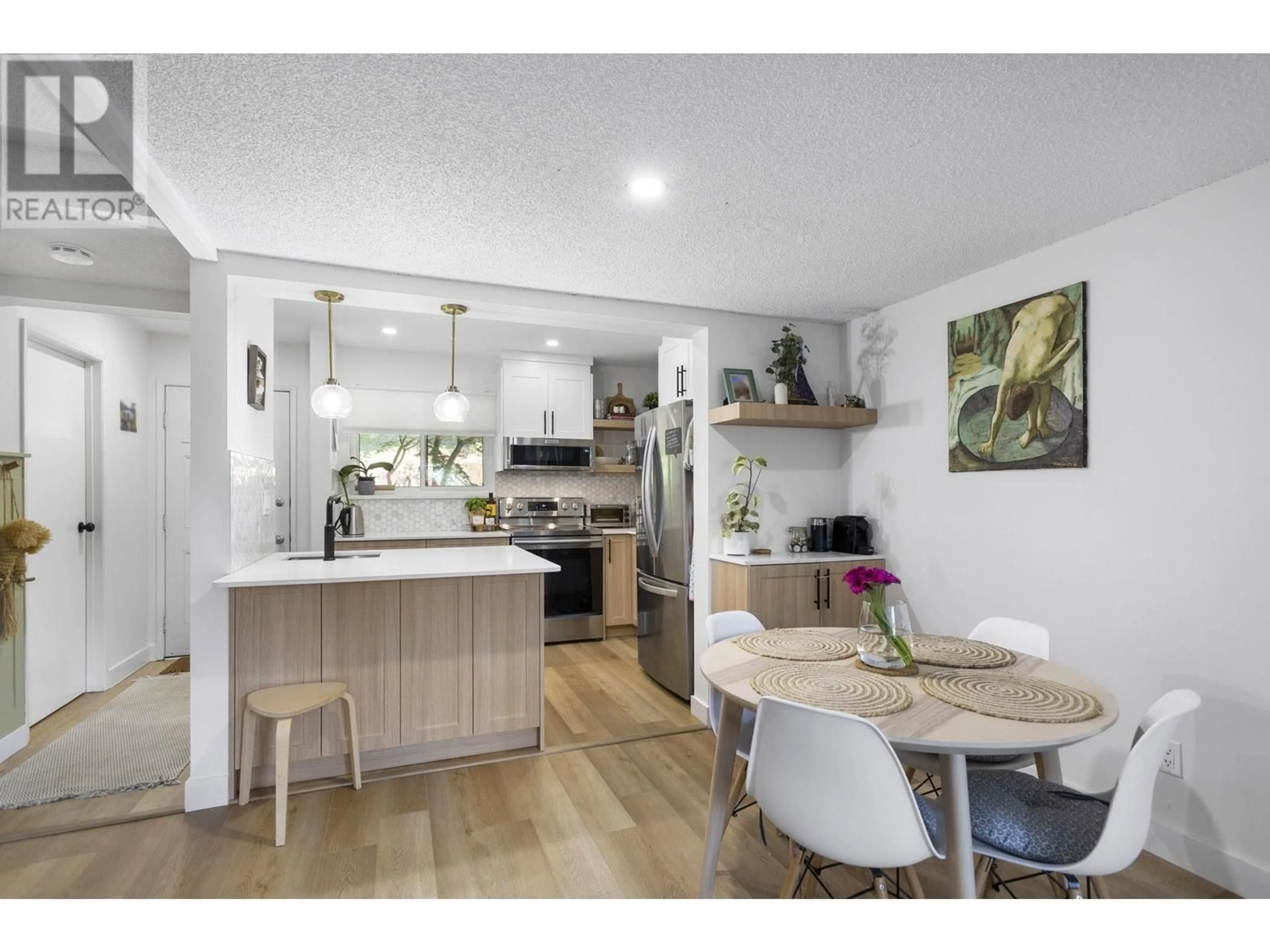 Open concept kitchen, wood/laminate floor for 915 BRITTON DRIVE, Port Moody British Columbia V3H3S5