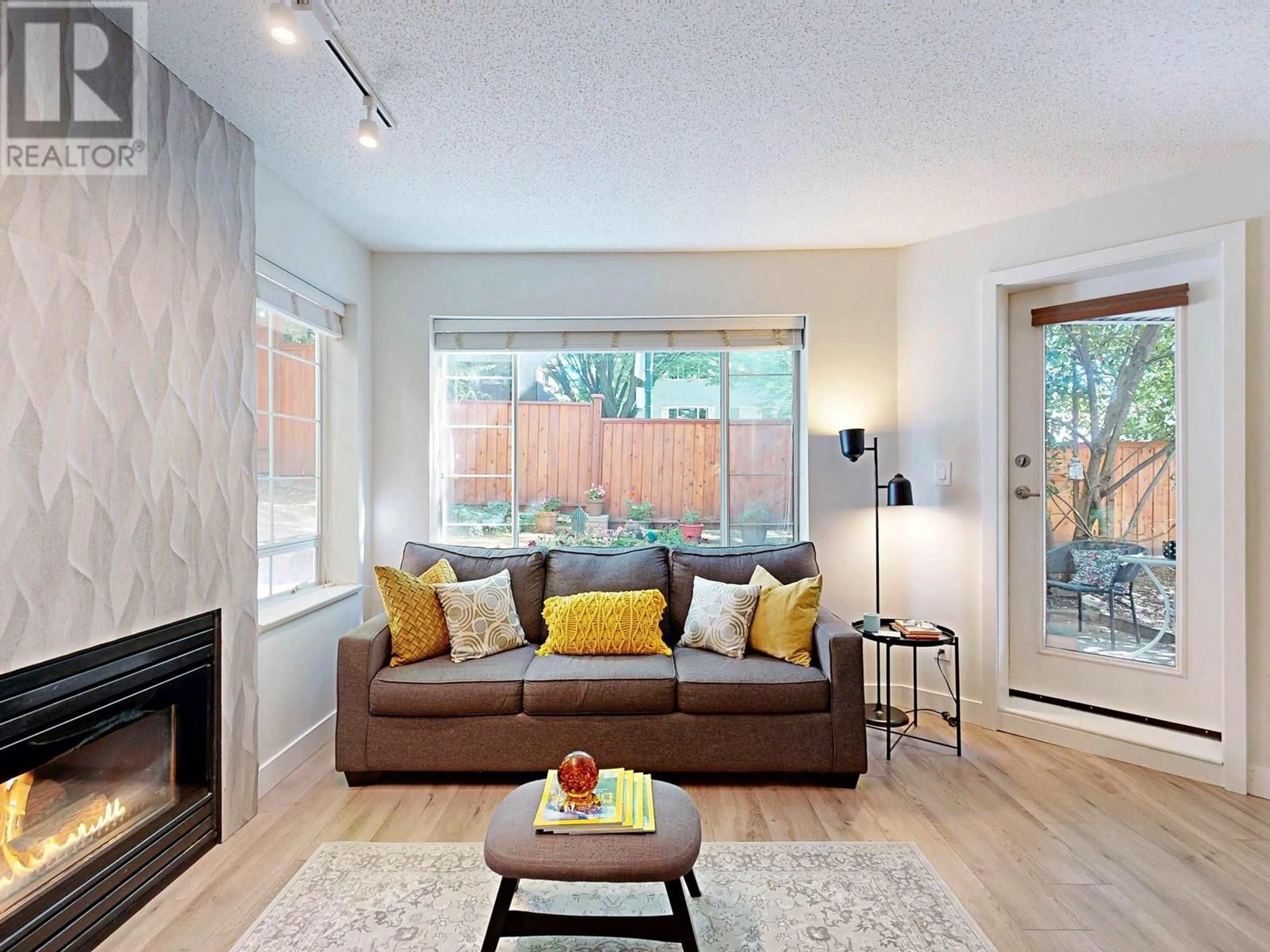 Living room with furniture, wood/laminate floor for 105 - 1433 1ST AVENUE, Vancouver British Columbia V5N1A4