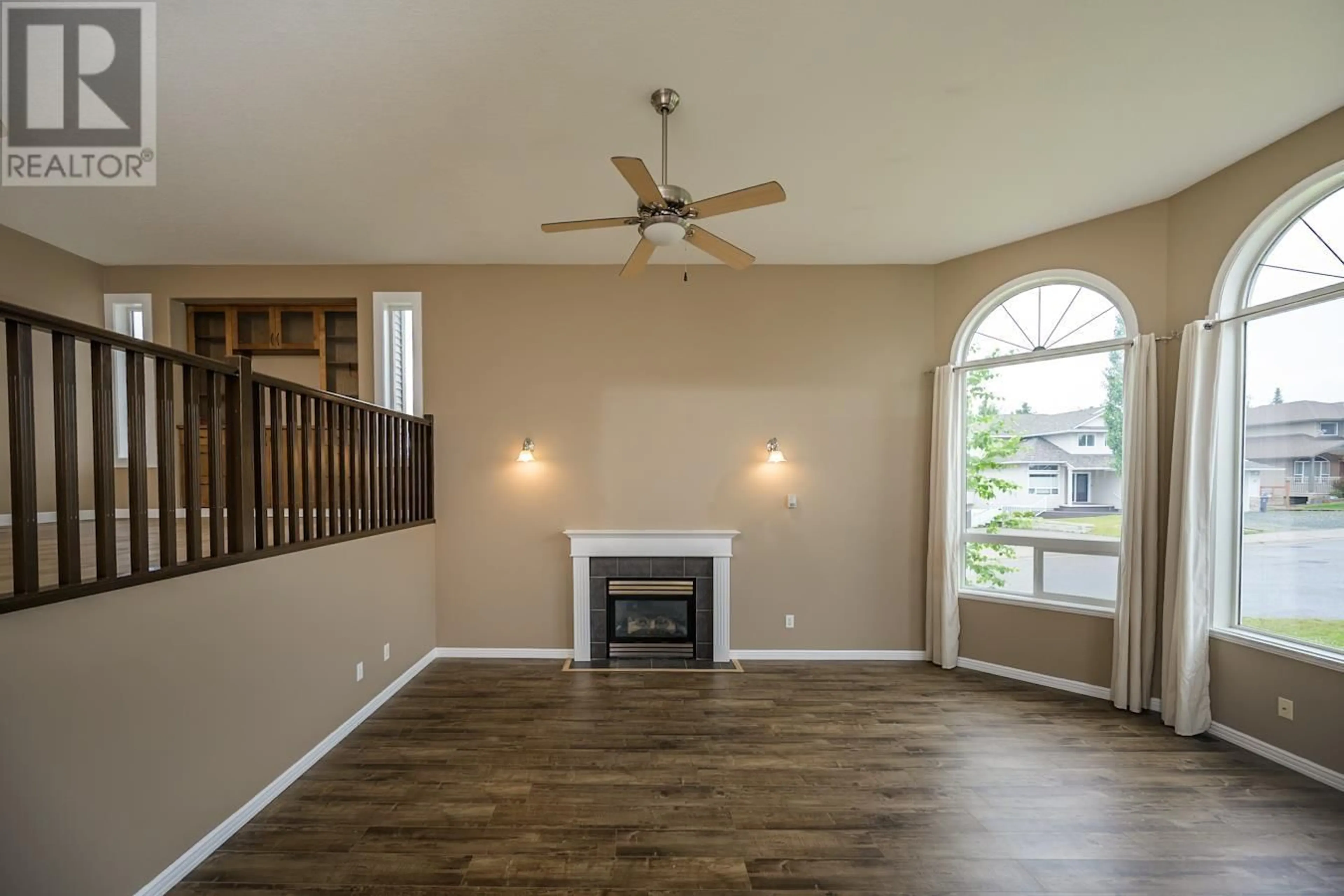 Living room with furniture, wood/laminate floor for 7003 TRYGG COURT, Prince George British Columbia V2N6Z8